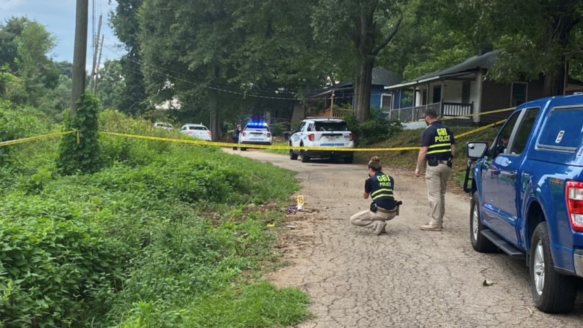 Police shot a man in LaGrange after he ran over his wife, ultimately dragging her under the car on Thursday in Troup County, according to GBI.