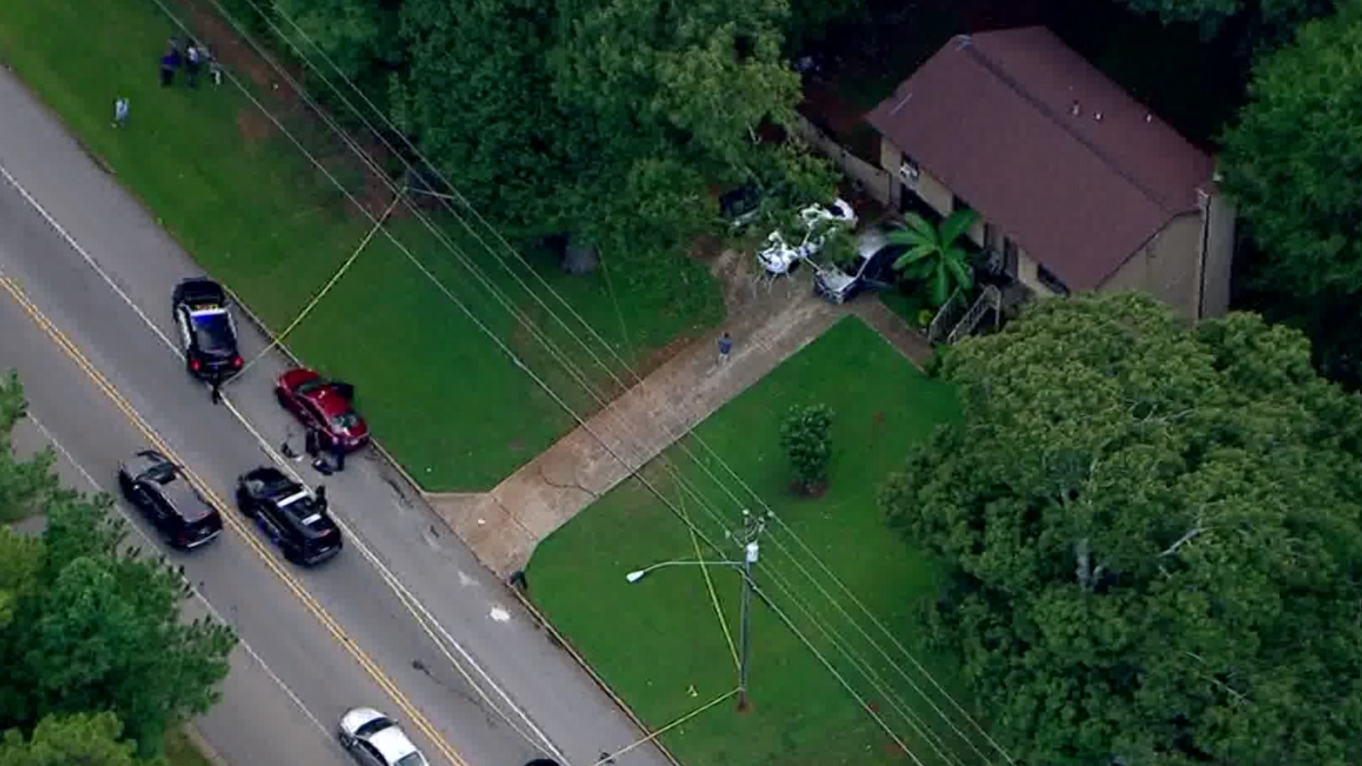 11Alive SkyTracker flew over a home along Flakes Mill Road where crime scene tape was spotted. Two men are critically hurt and another had minor injuries.