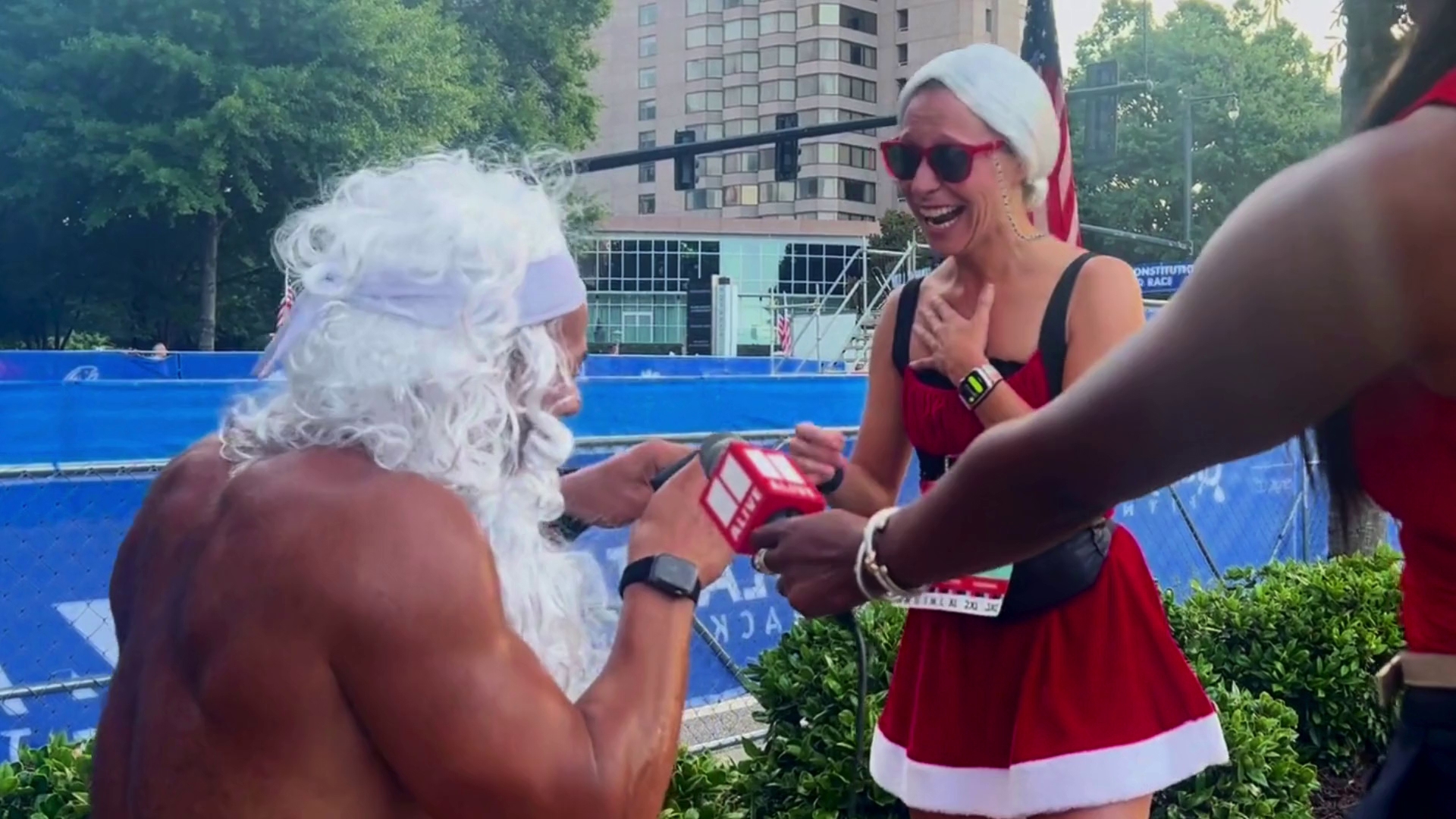 A Peachtree Road Race runner who dresses as a hulked-out Santa every year proposed to his girlfriend this year!