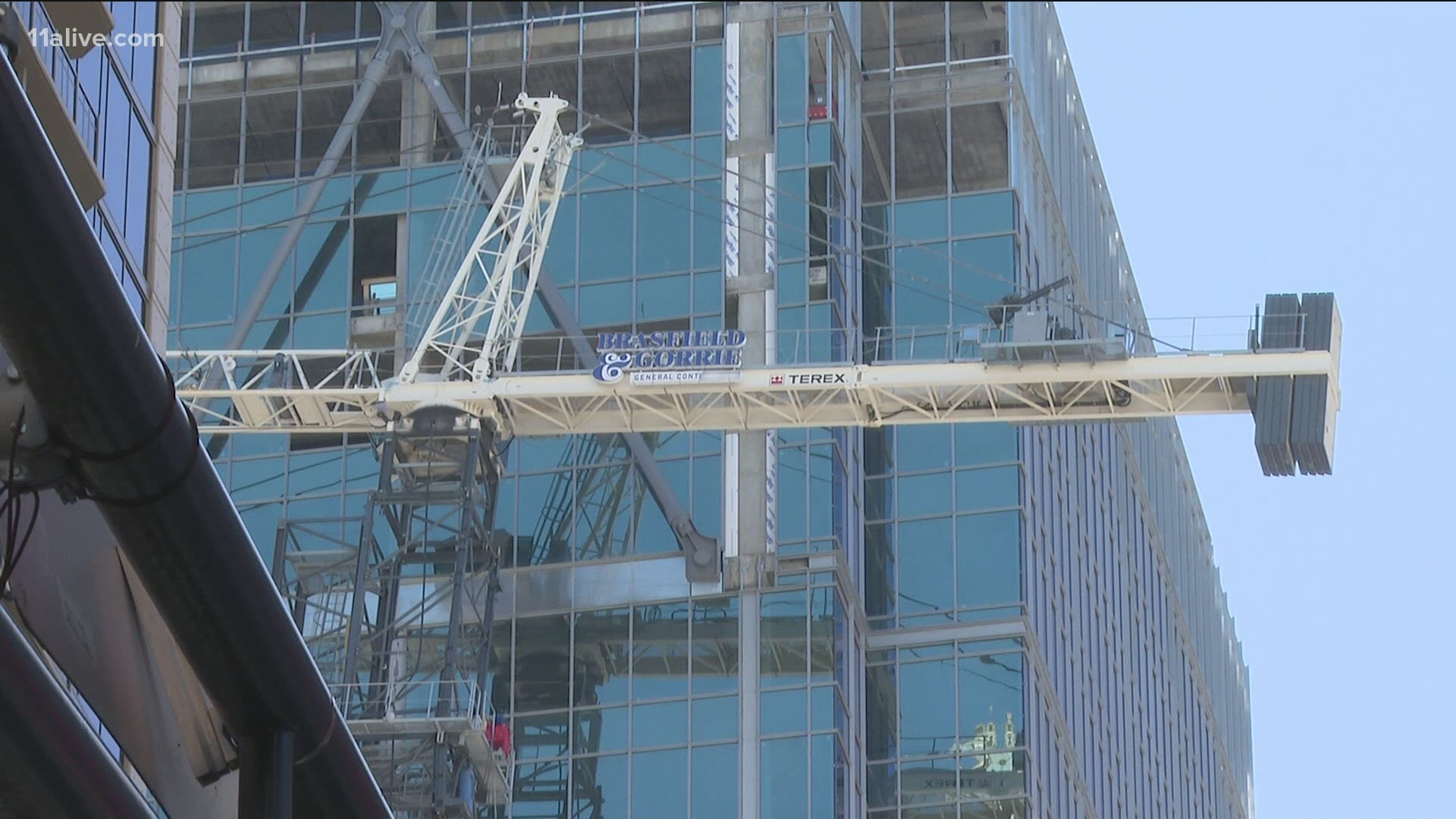 The crane has been leaning up against a building.