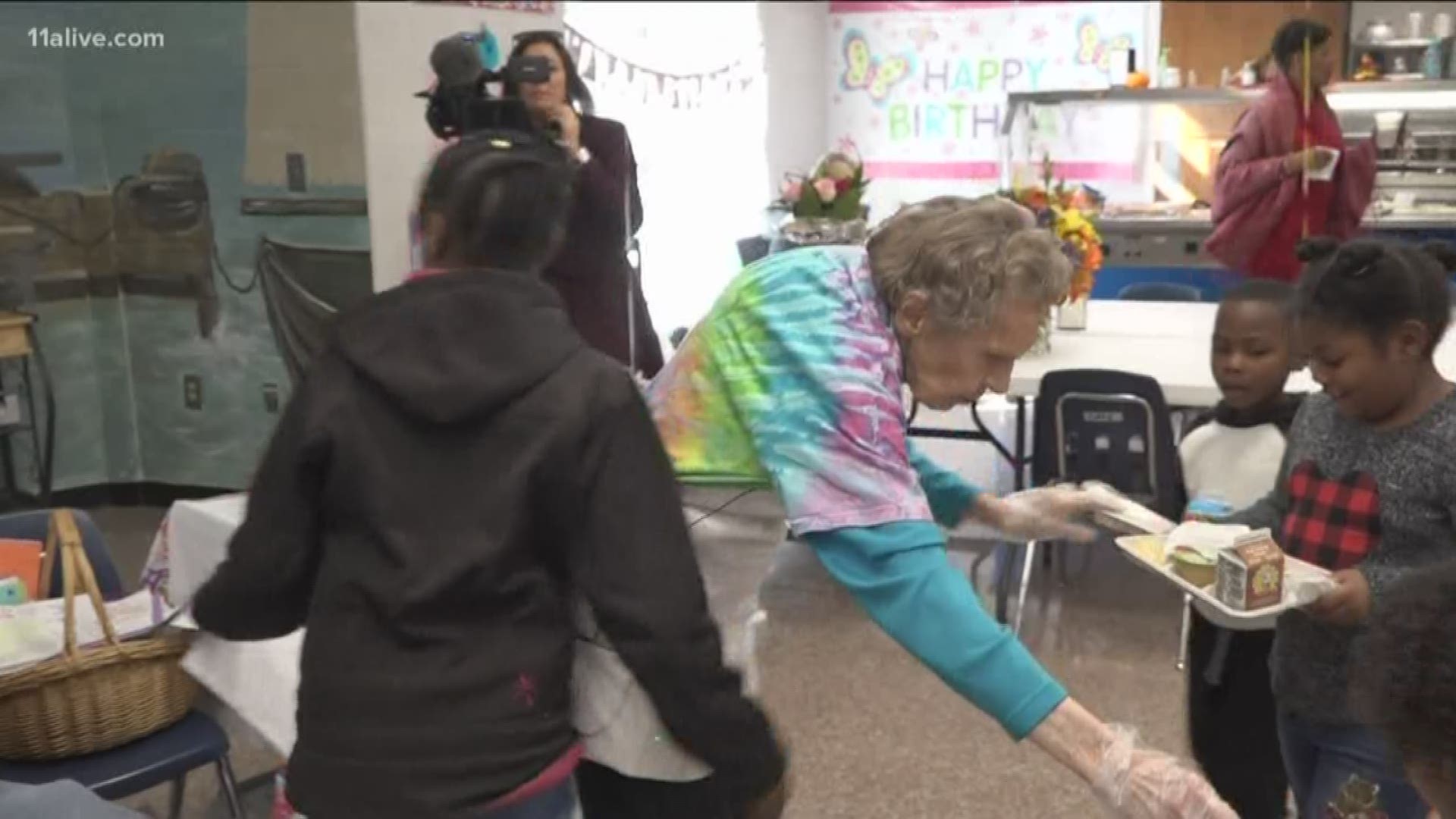 Martha Strickland, known as "Granny", handed out cookies Tuesday at Shiloh Elementary School to celebrate her 95th birthday.