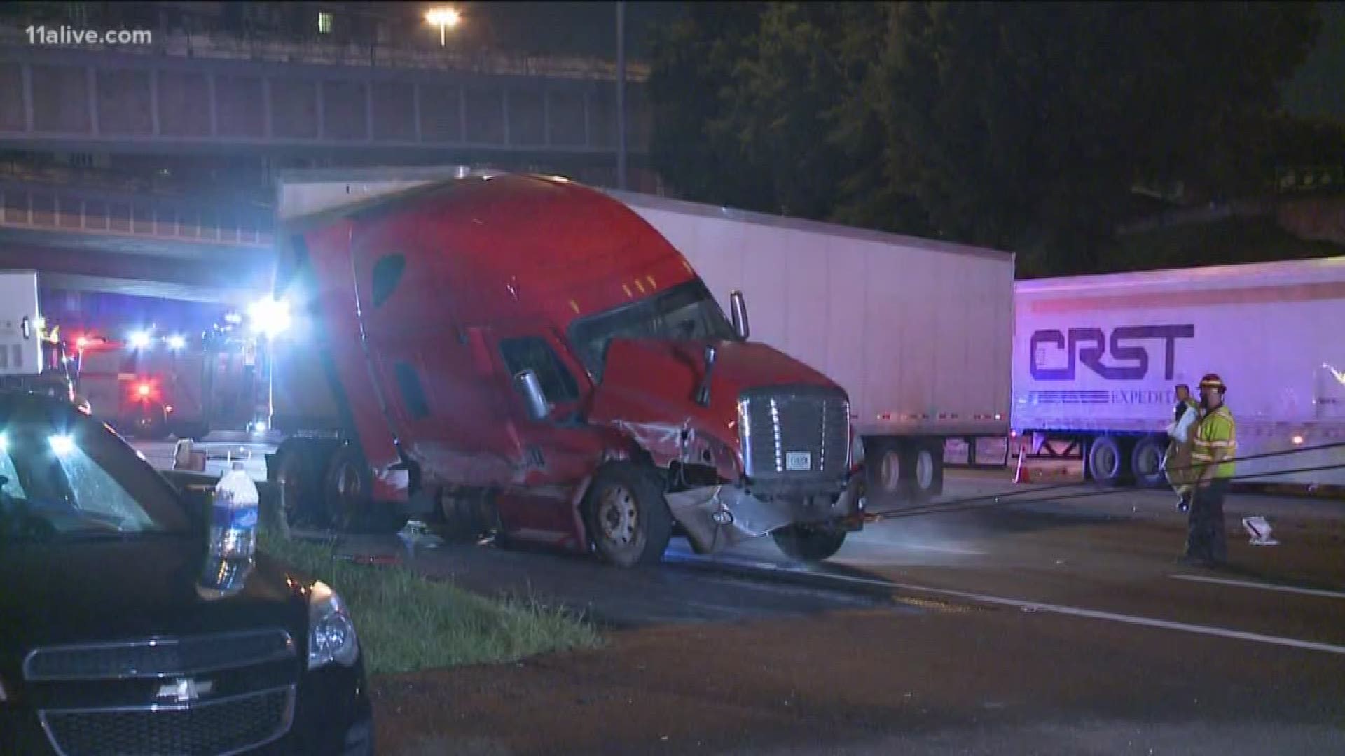 Jackknife tractor trailer on downtown connector