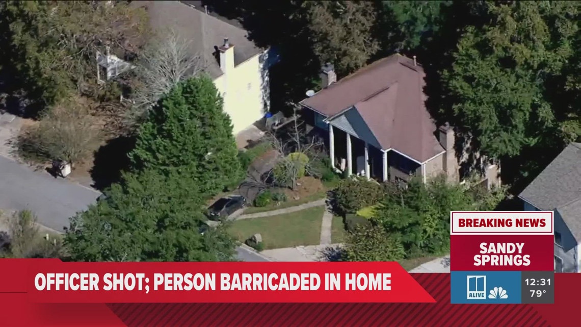 Sandy Springs officer shot, subject is barricaded in neighborhood ...
