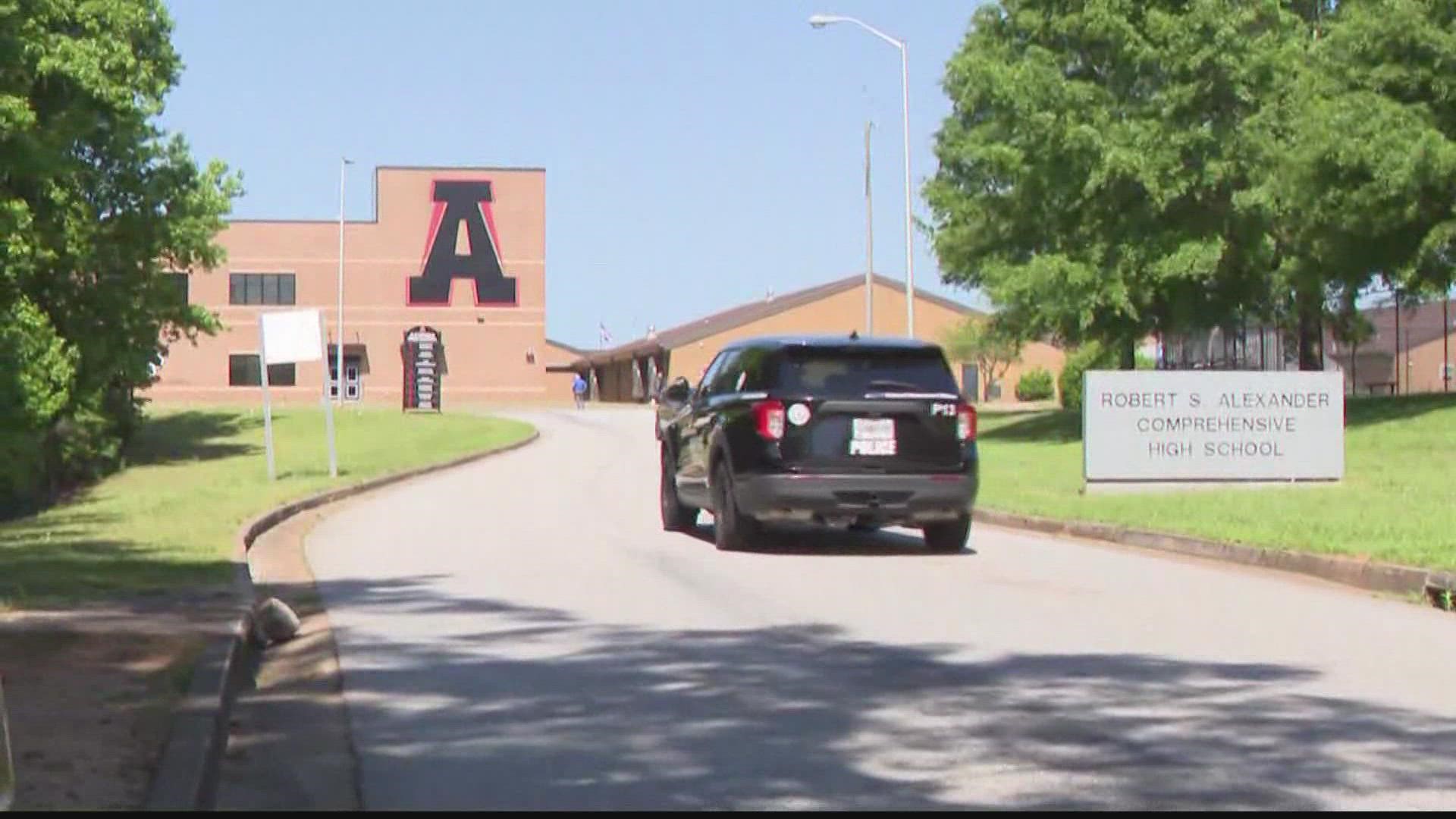 The student at the center of a manhunt Tuesday has turned himself in after authorities said he hurt one of his peers in an altercation at Alexander High School.