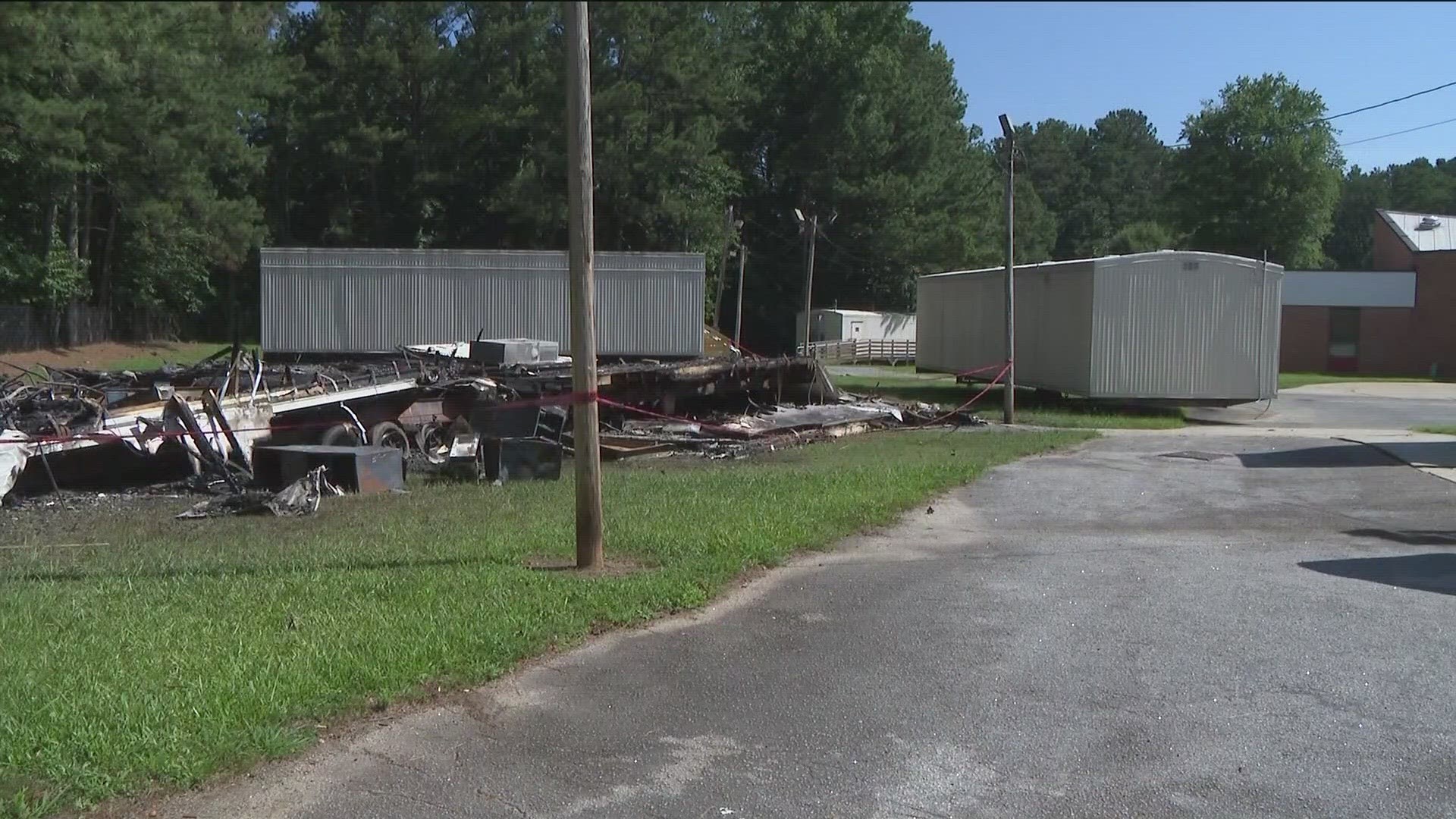 DeKalb County Fire Rescue Department reported two classroom trailers were "fully engulfed in flames."