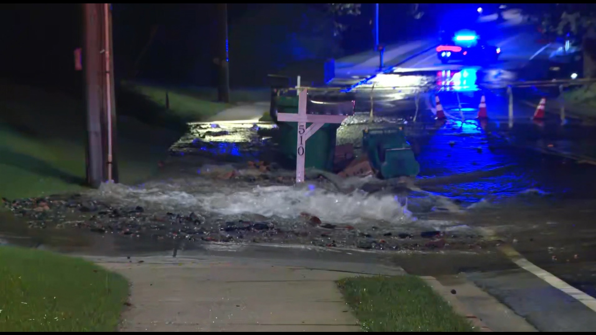 Video shows water gushing in the street.