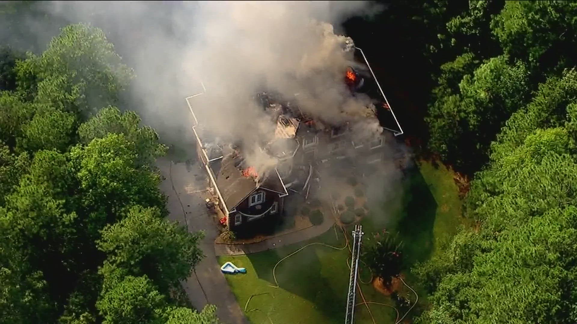 Flames and smoke can be seen coming out of the home on Demooney Road.