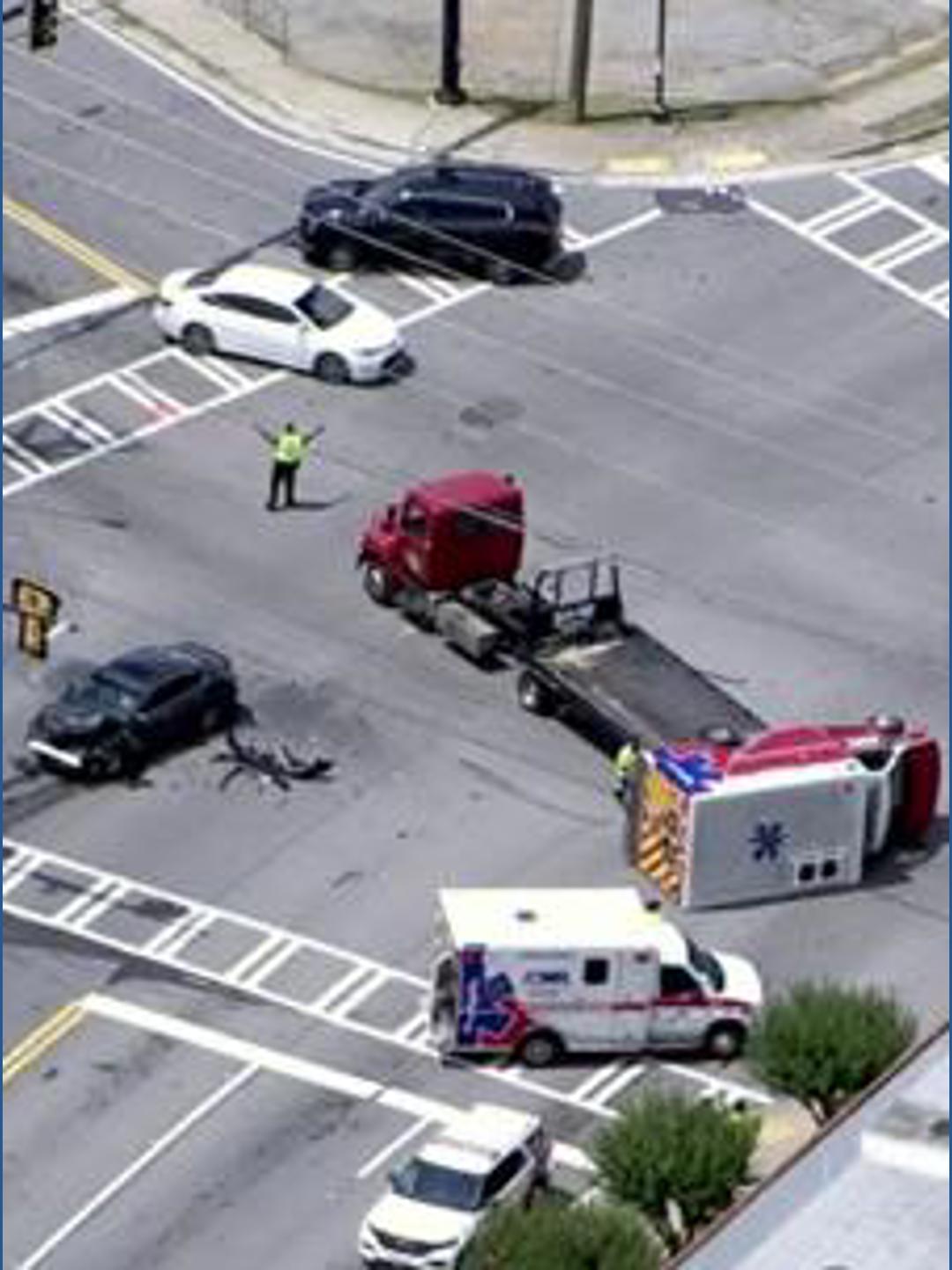 Ambulance overturns after crash in DeKalb on Lavista Road | 11alive.com