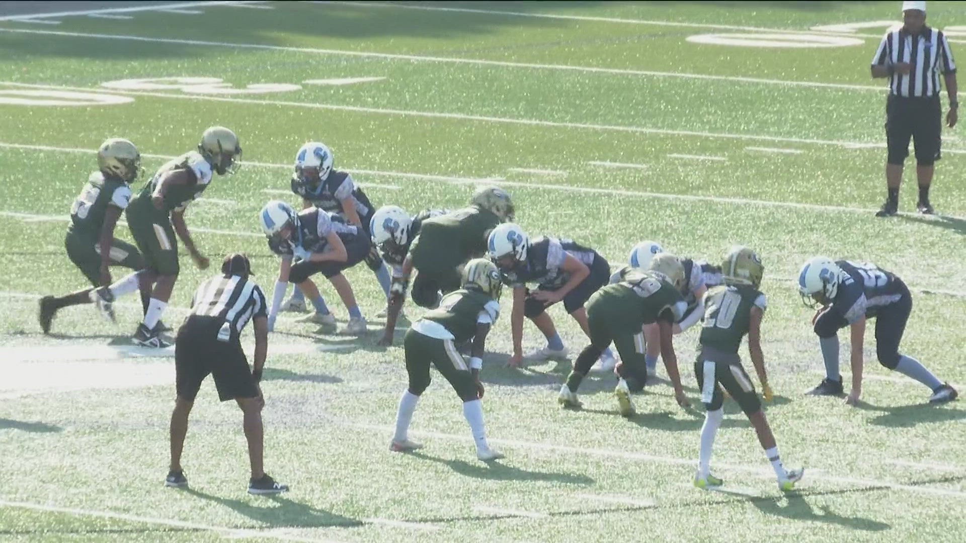 Sheriff's offices unite for kids football tournament