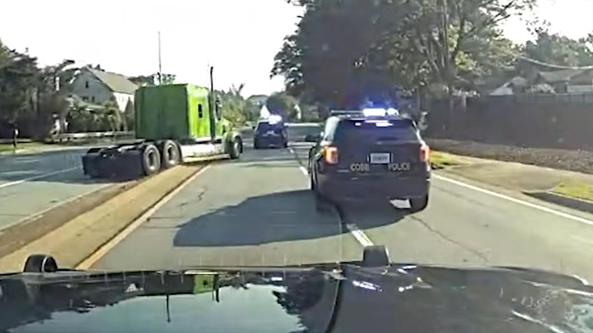 Dashcam video shows the moment a driver, accused of stealing a semi-truck, led police on a chase in Cobb County.
