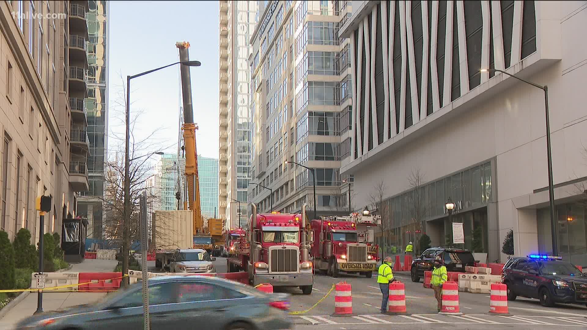 A mechanical failure has been blamed for the crane's instability, which has forced the area to be evacuated.