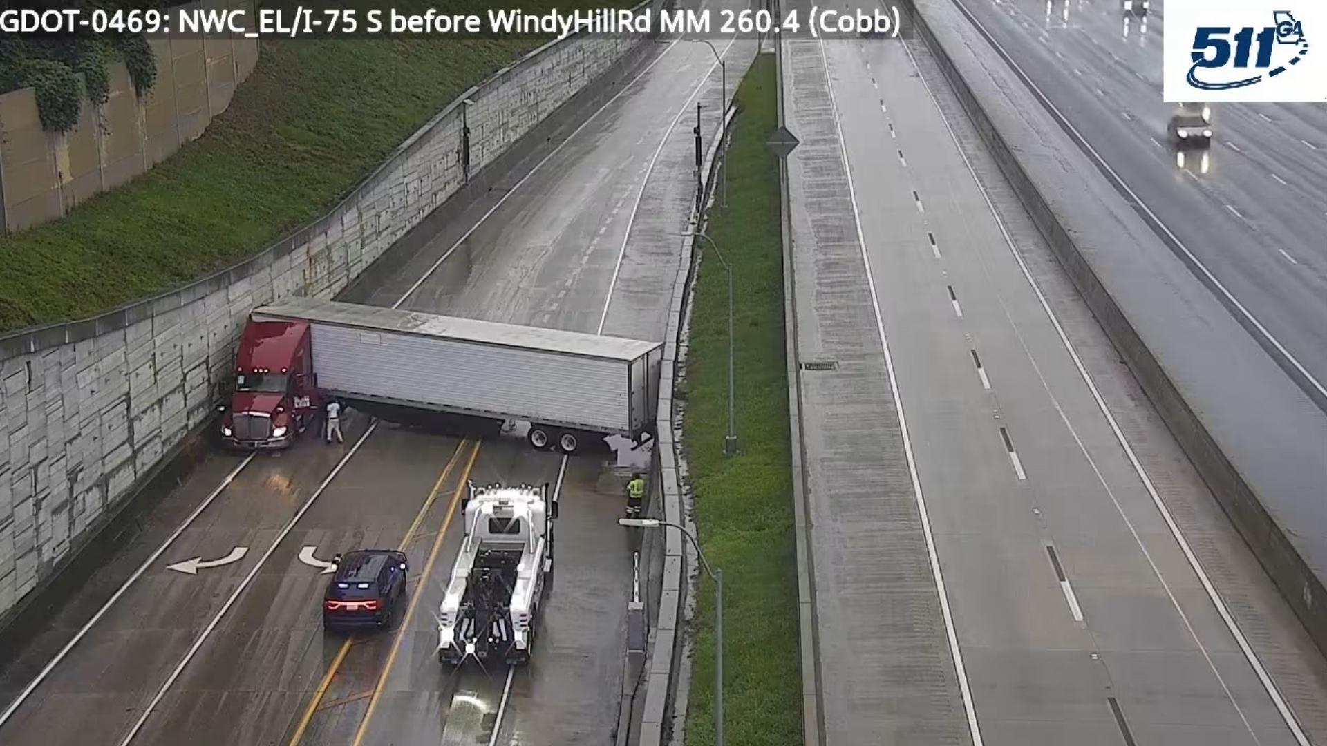 Jackknifed tractor-trailer blocks I-75 North express lanes in Cobb ...