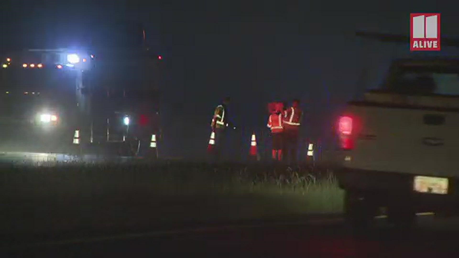 Crews work to clear the scene of a crash on GA 20 in Bartow County overnight on Monday.