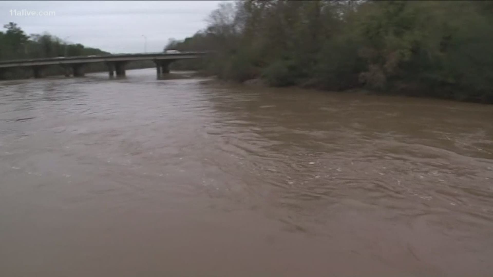 Big Creek, which rushes into the Chattahoochee River near Roswell, is rising as rain continues to fall. The river is expected to crest by Friday.