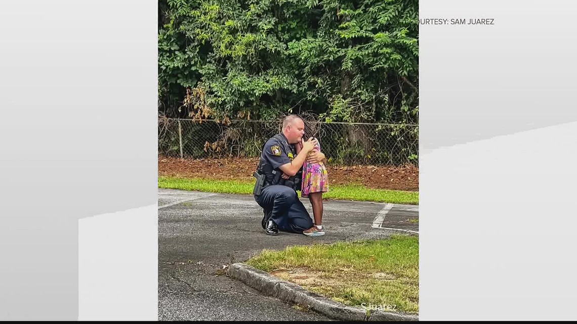 Morrow police officer comforts girl