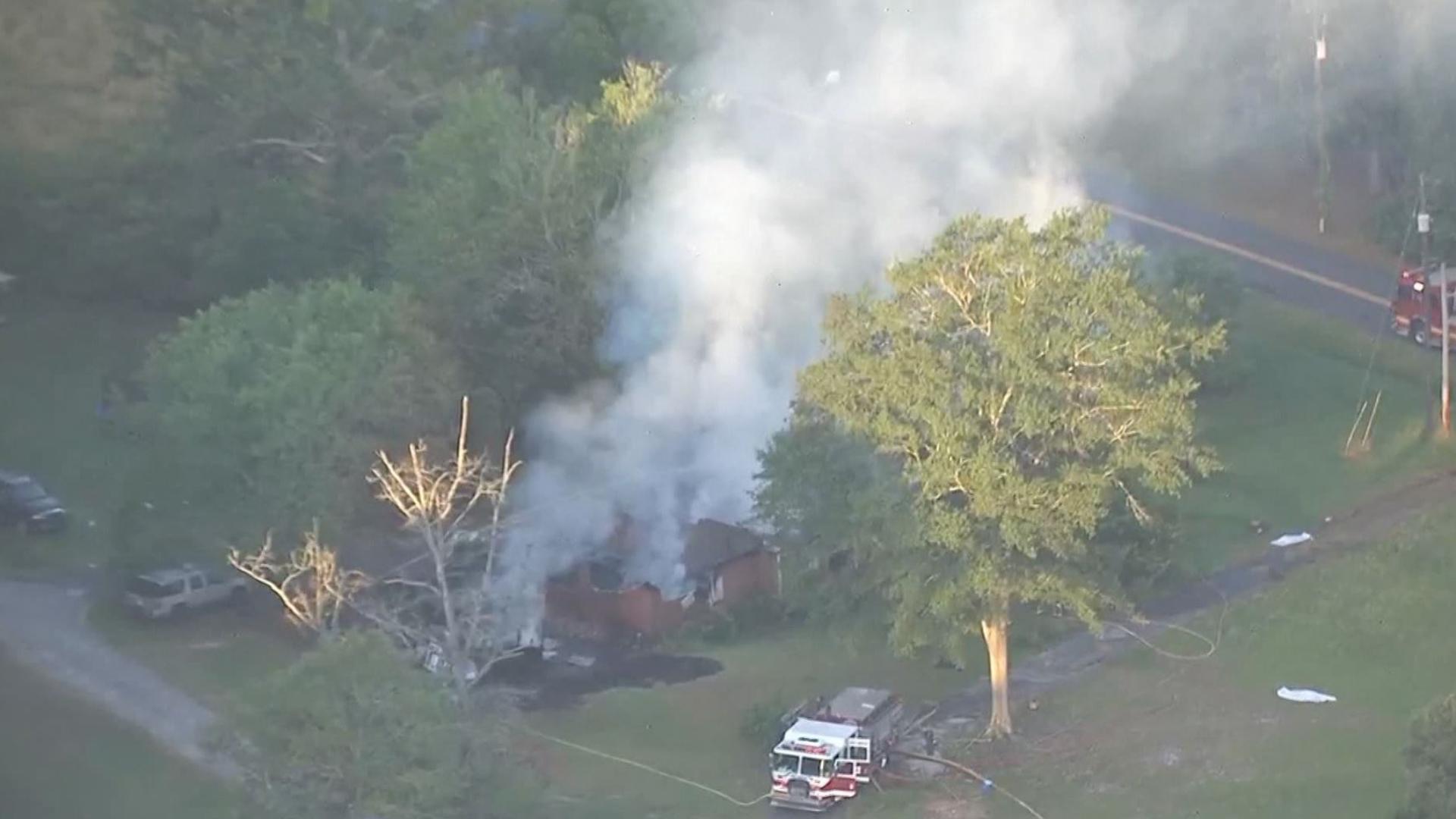 Coweta County Fire crews are currently working to put out flames at a house on Macedonia Road in Newnan Monday morning.
