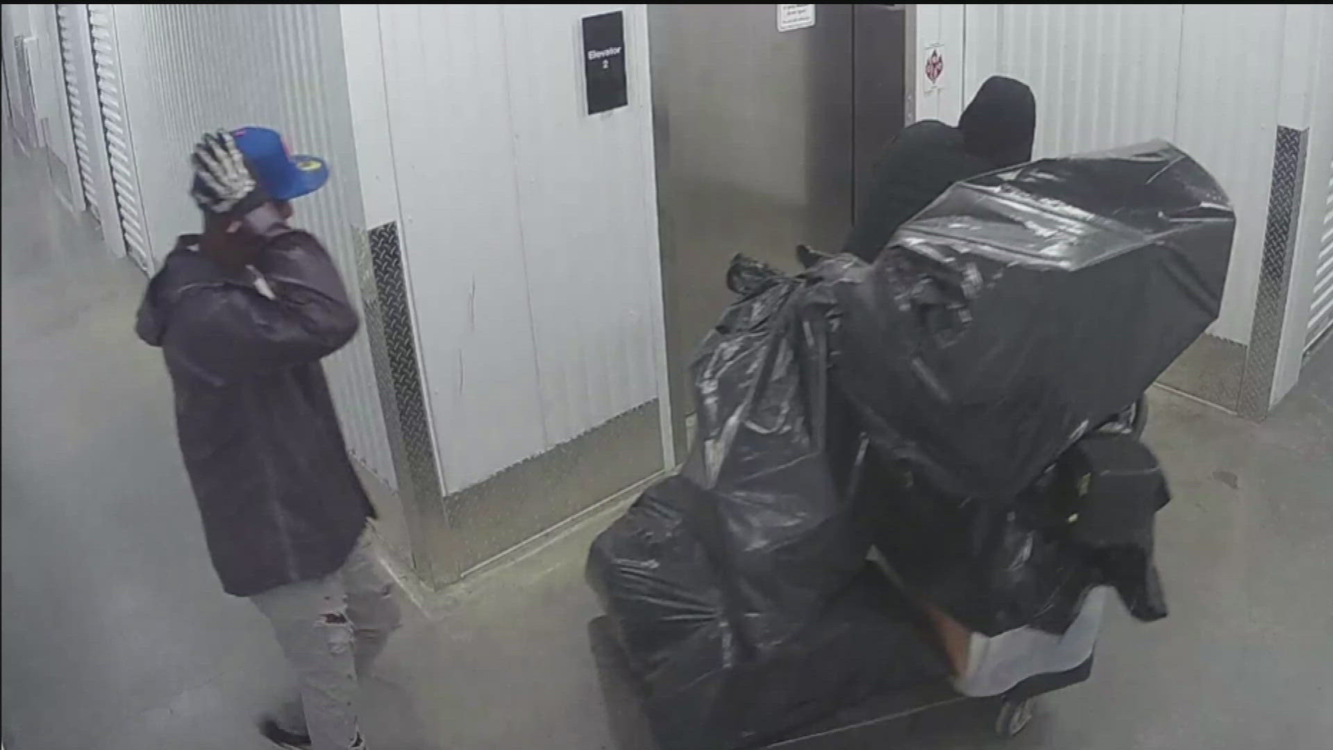 Surveillance video shows suspects inside Extra Space Storage on Bishop Street. A local DJ is among victims who said thousands of dollars of belongings were stolen.
