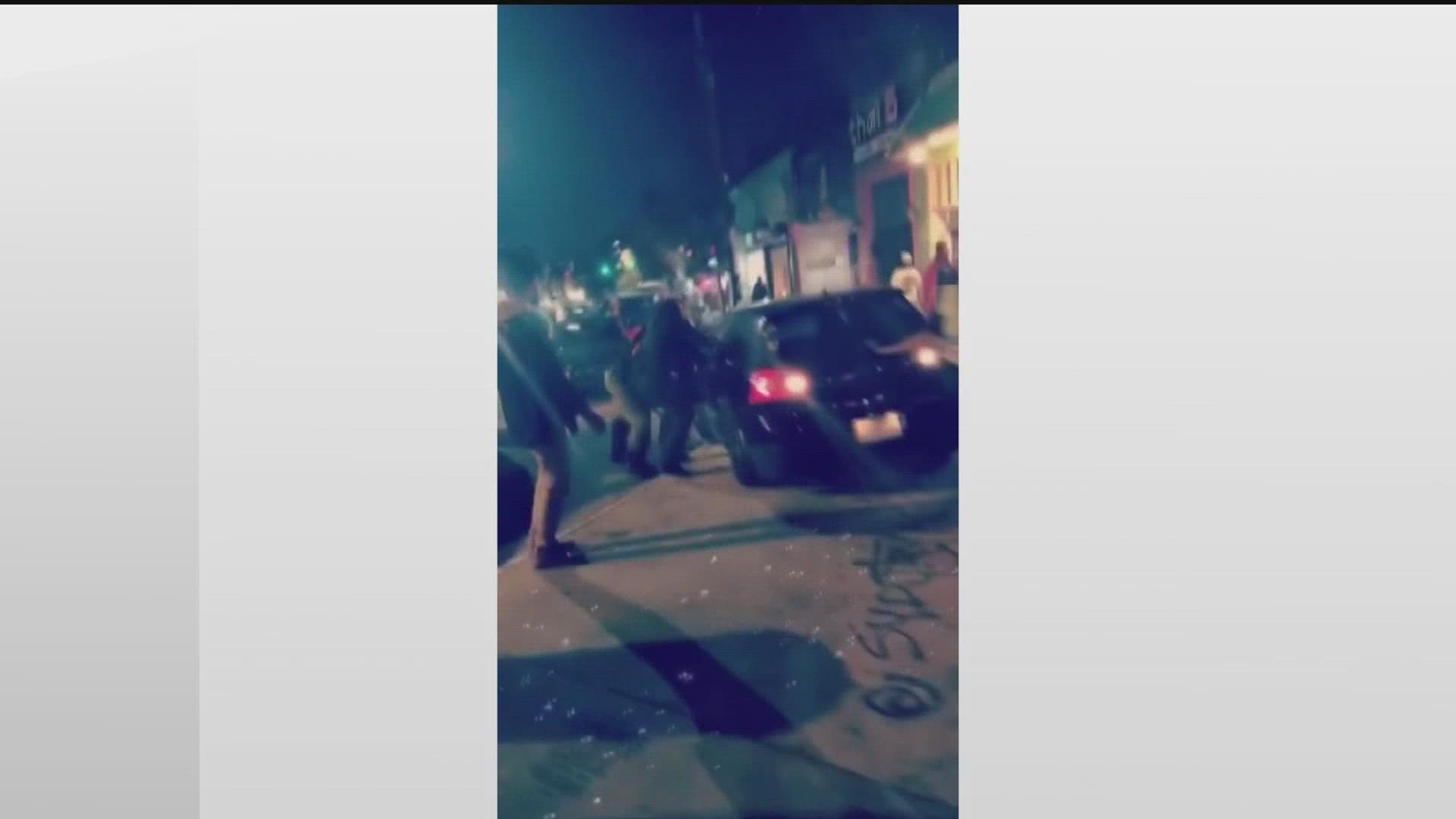 Video captured the moment a man drove down the sidewalk along Euclid Avenue on Sunday night. APD officers rushed over and eventually pulled the man out of the car.