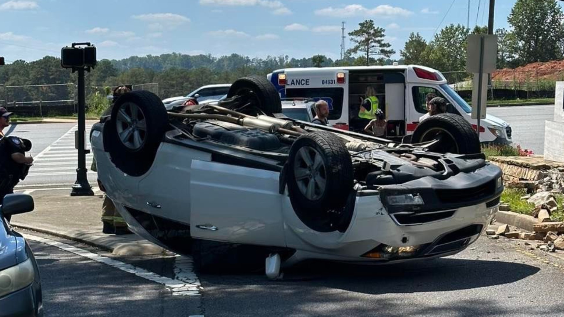 Driver survives after car flips near busy Alpharetta intersection