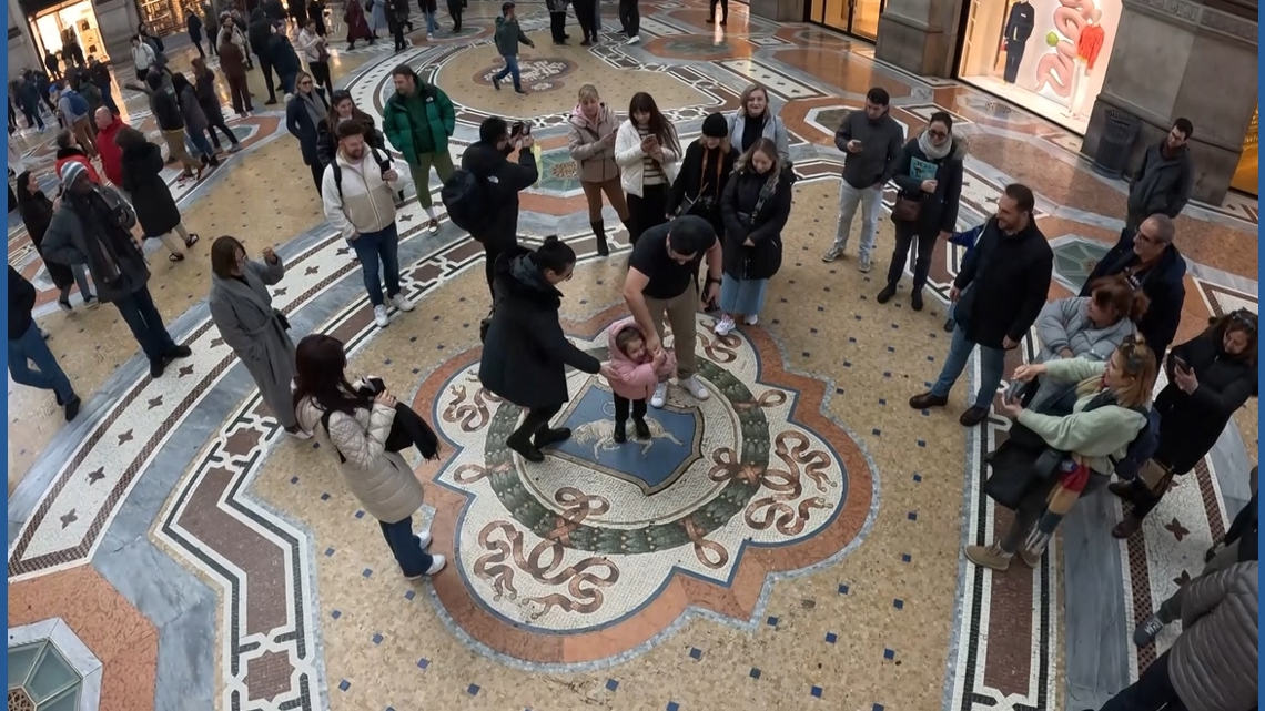 Olympic hopefuls, tourists seek good luck at Milan’s famous spinning bull