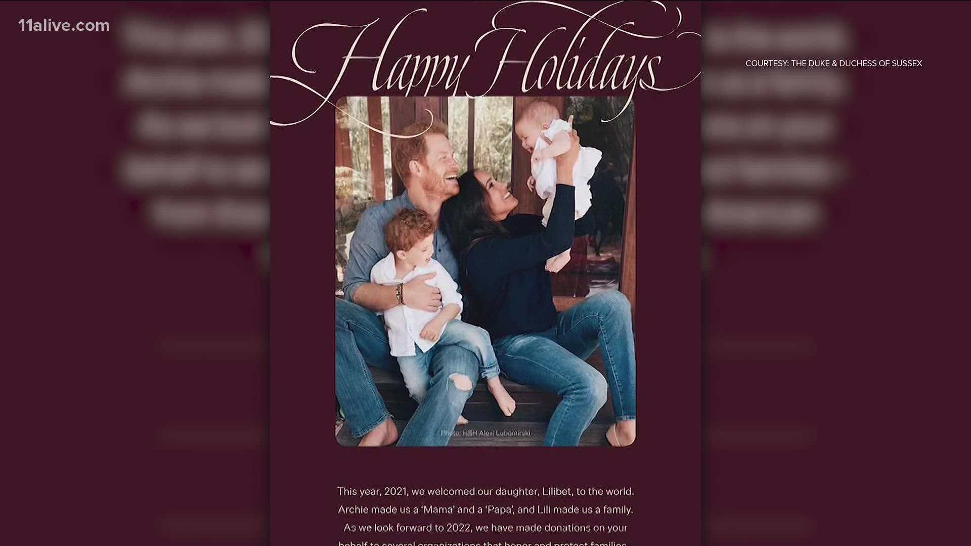 The new family photo from the Duke and Duchess of Sussex features a smiling Archie on his dad's lap, while Meghan sits next to them and holds up Lilibet.