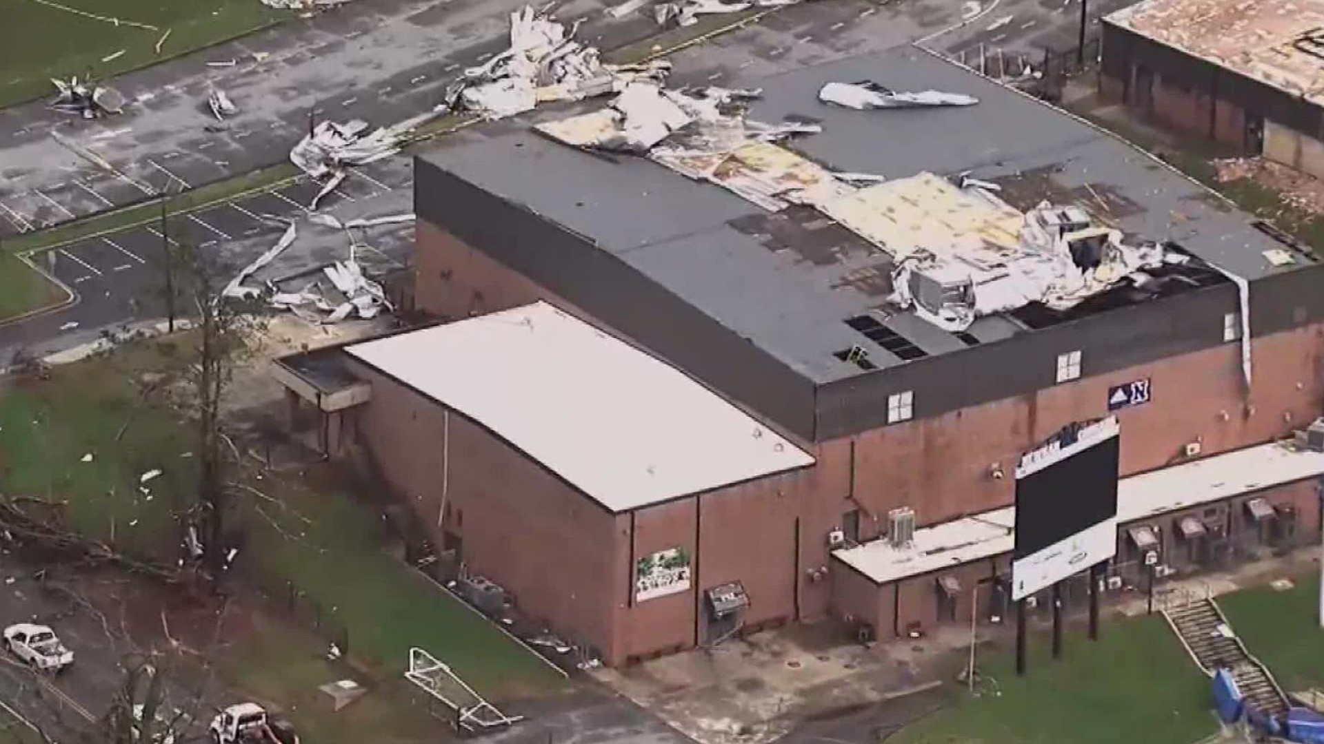 A year later, the high school still has damage from the storm but the community continues to uphold generations of traditions and say 'Newnan Strong.'