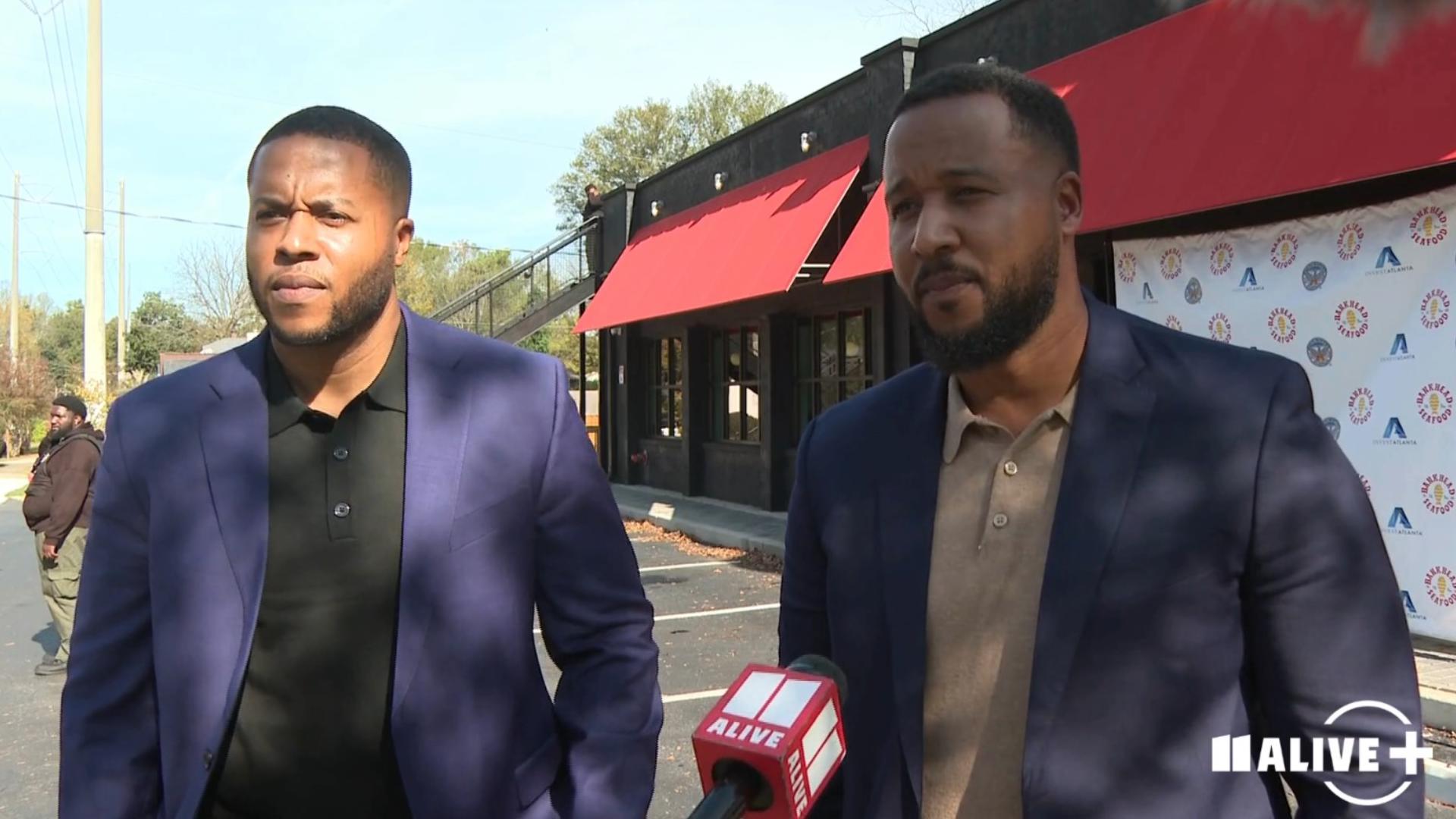 Derrick Cannon (Left) and Johnnie Cannon (Right) of DJR Construction Group talk with 11Alive's Nicholas DiVaccaro about the re-opening of Bankhead Seafood.