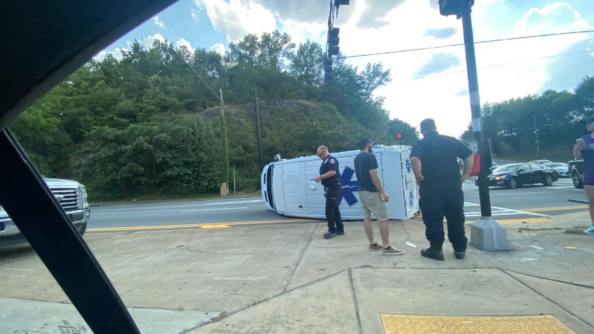 Ambulance flips over after being hit, driver arrested in DeKalb ...