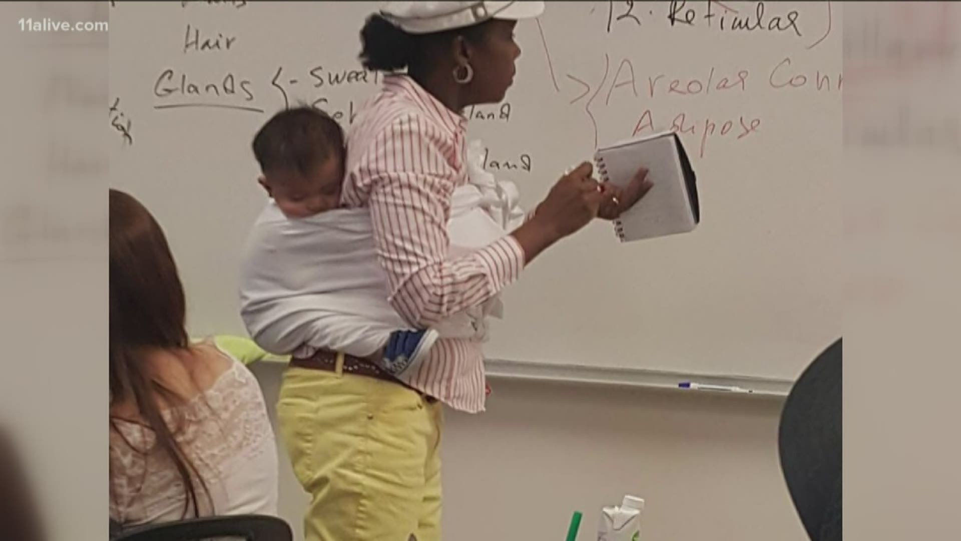 The Georgia Gwinnett professor offered to carry the baby so her mom could concentrate during class. The mother said the babysitter got sick.