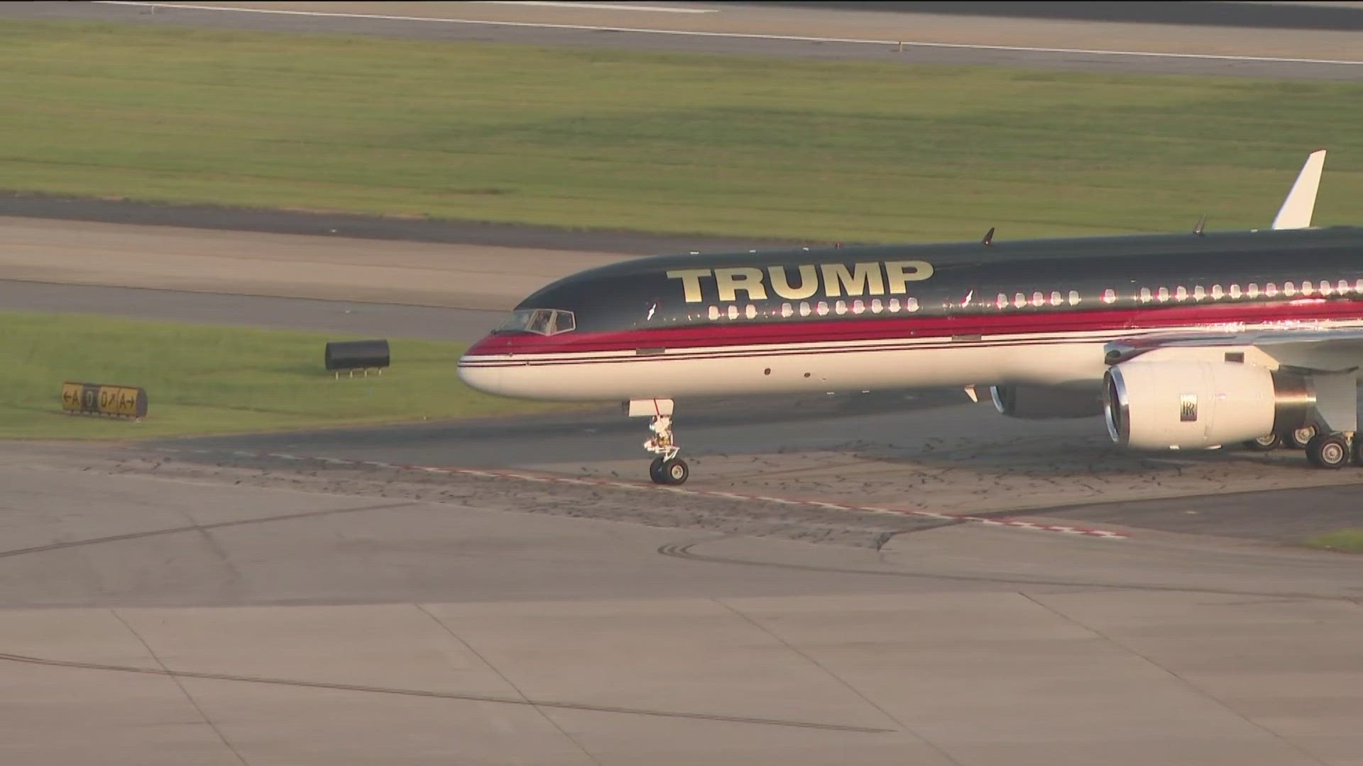 Former President Trump's plane touched down just after 7 p.m. after flying a little more than two hours from Newark, New Jersey.