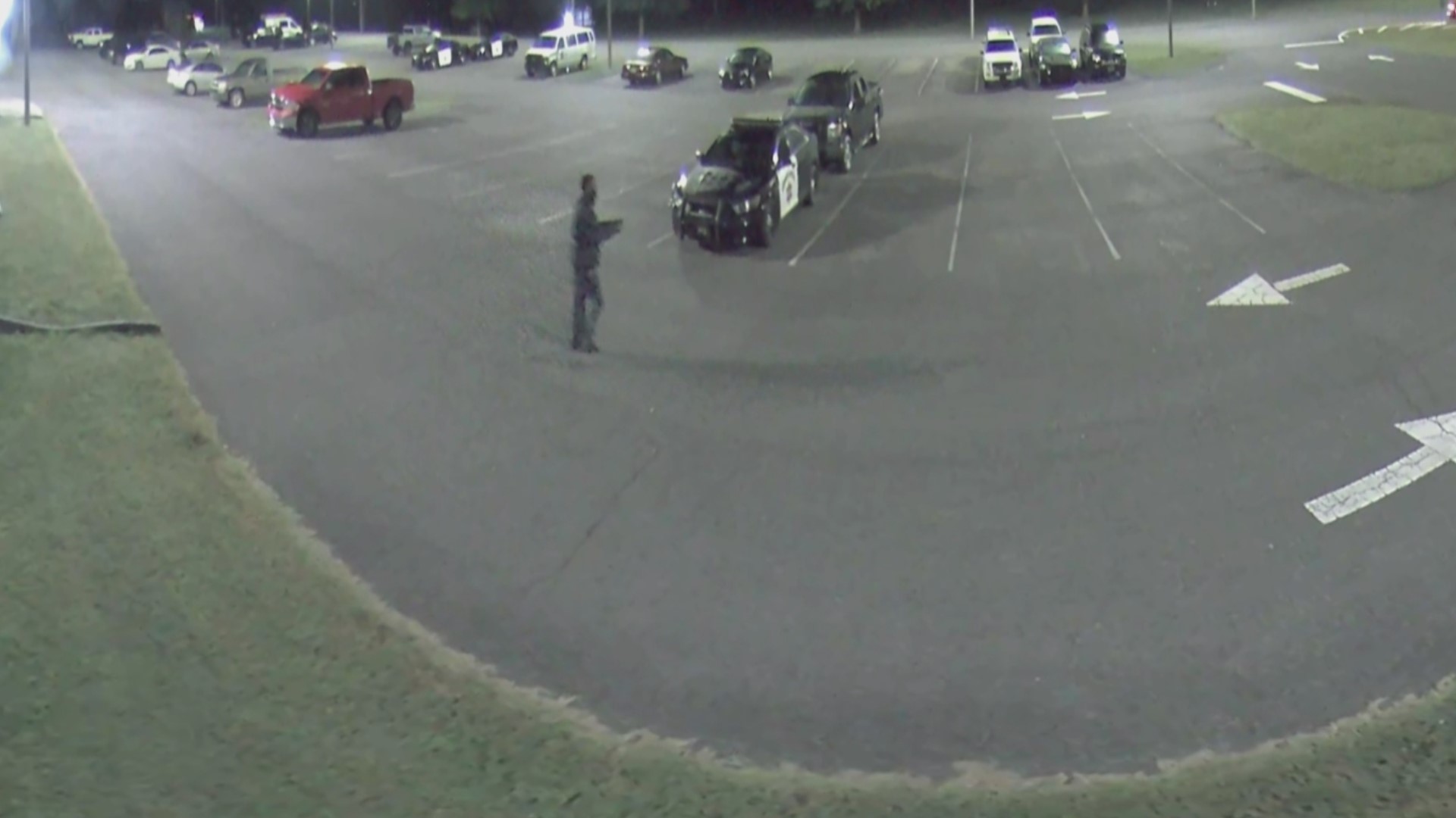 Surveillance video from the sheriff's office shows the man walking across the parking lot and pointing a gun. No one was hurt, the sheriff said.