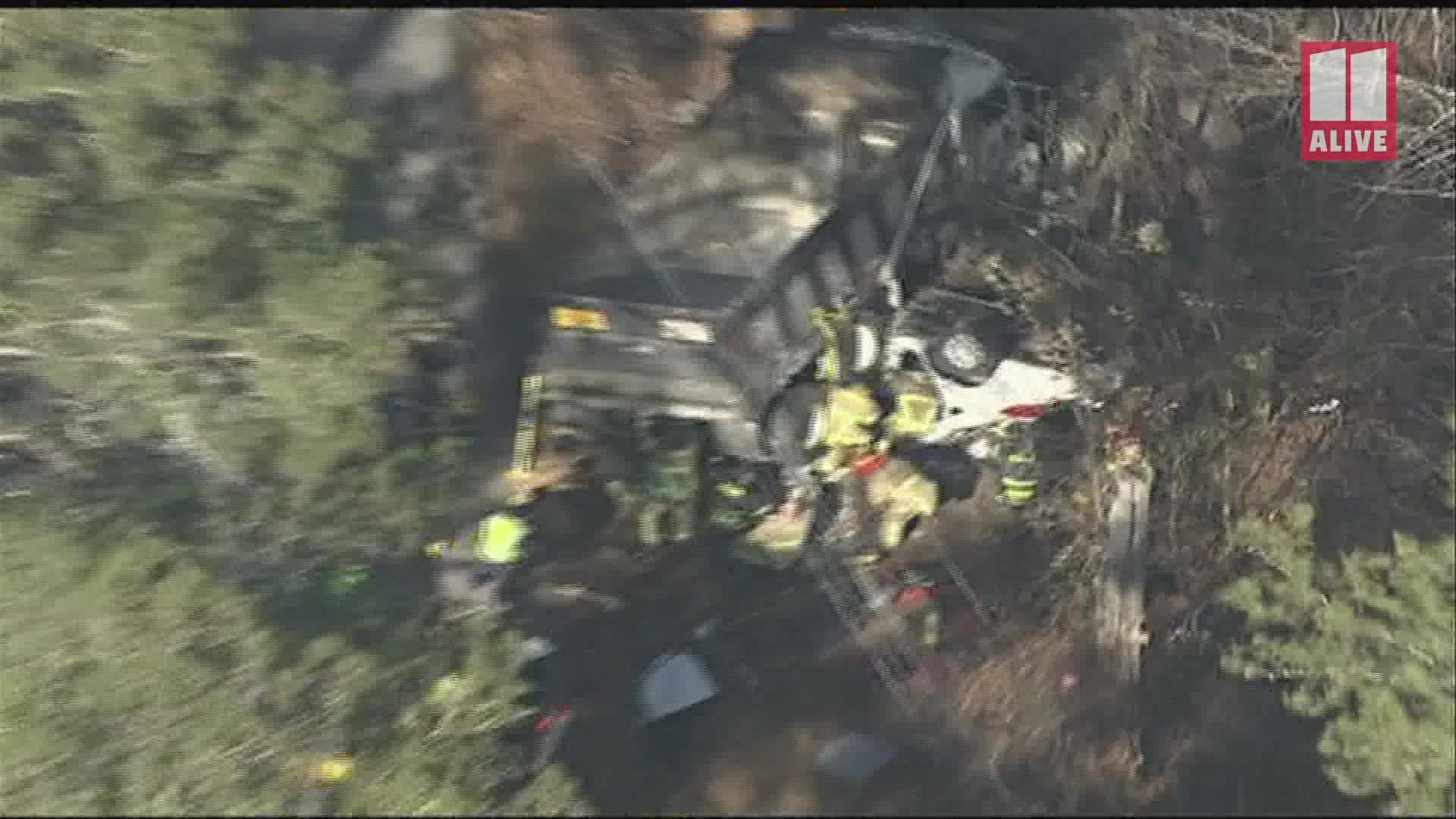 Video from 11Alive SkyTracker shows what looks like to be the dump truck on top of a vehicle and firefighters at work.