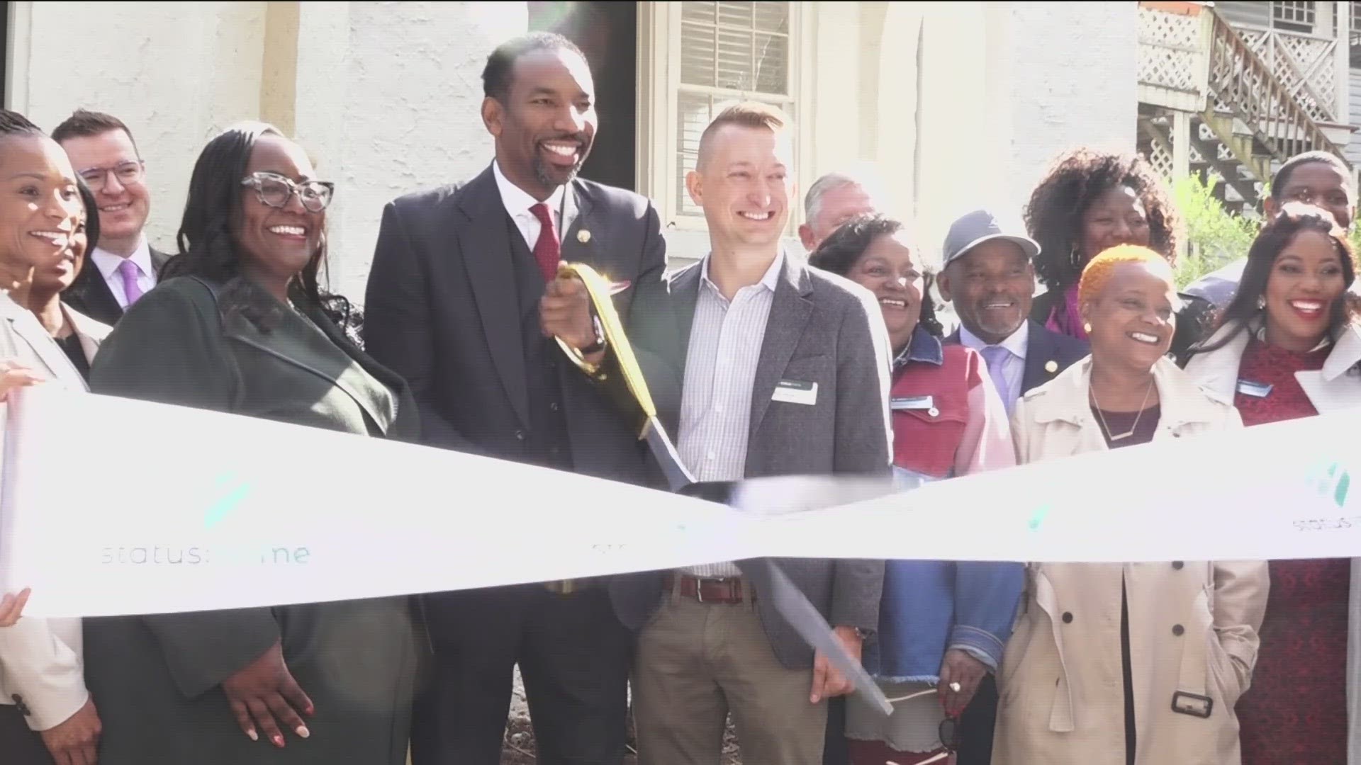 Atlanta Mayor Dickens and leaders cut the ribbon on new property with Status Home on Monday.