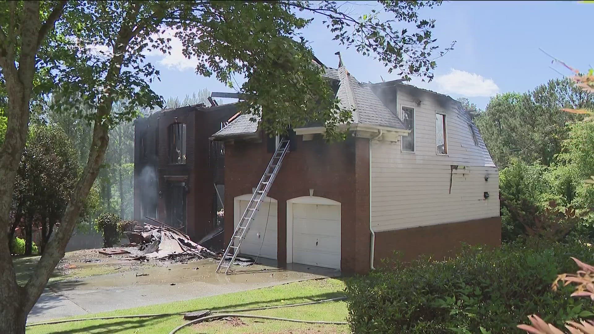 The fire appears to have destroyed a two-story home, with only the skeleton and rubble remaining.