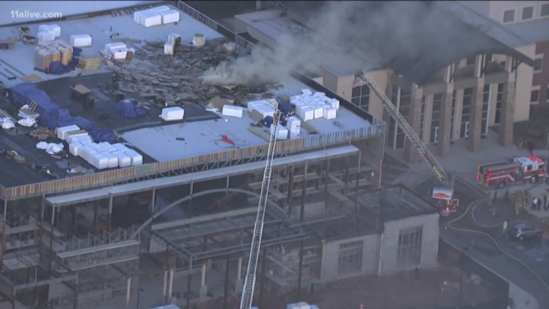 Smoke can be seen from the roof.