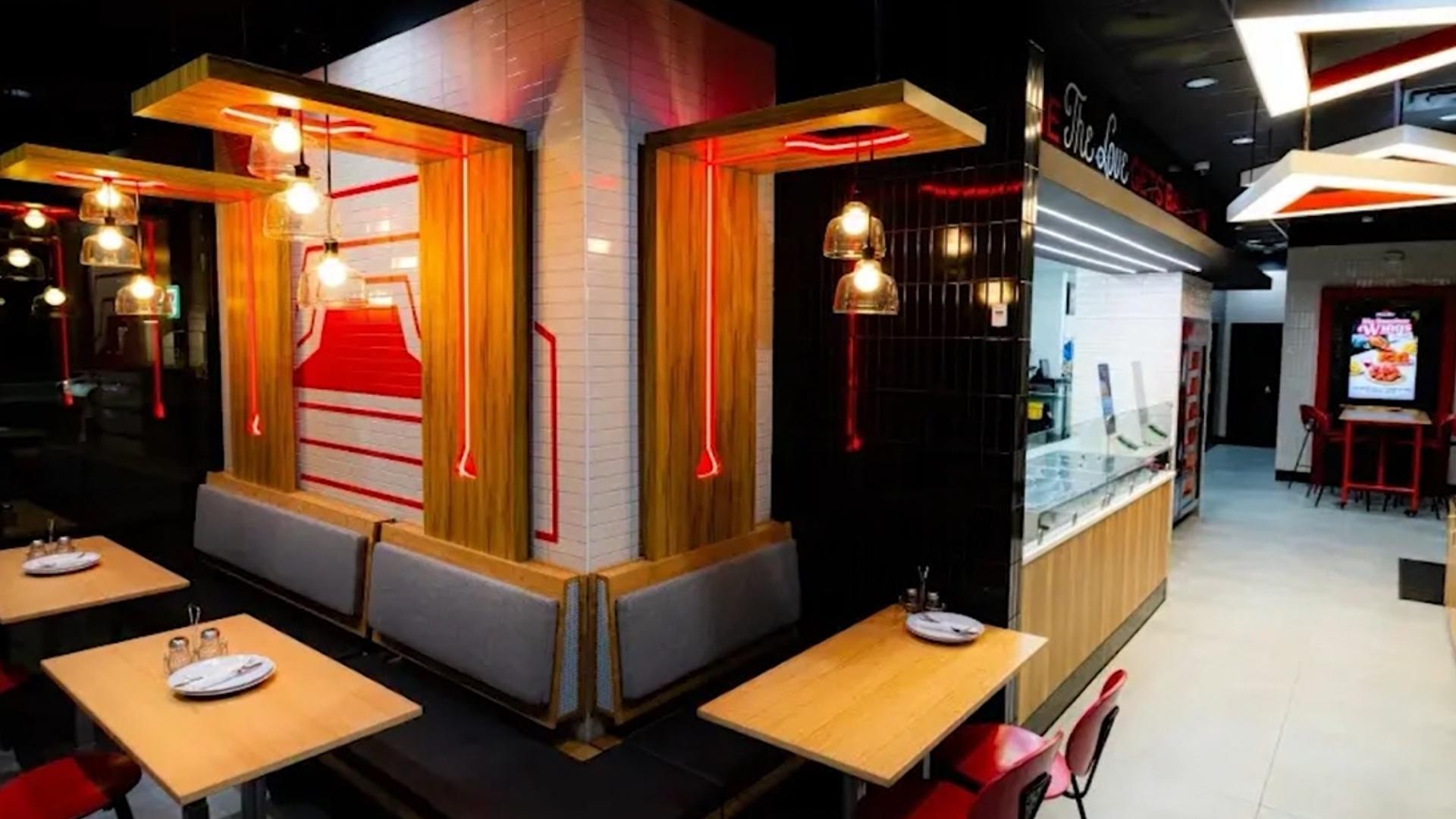 Pizza Hut unveils a new design concept featuring a front-facing pizza-making counter.