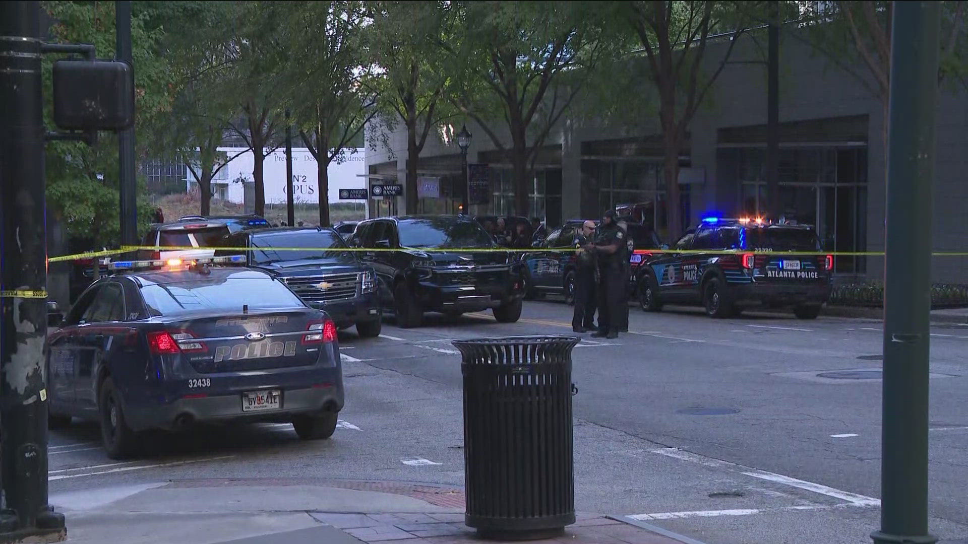 A person has been taken into custody after shots were fired around the busy Four Seasons Hotel in Midtown Atlanta on Tuesday afternoon. 