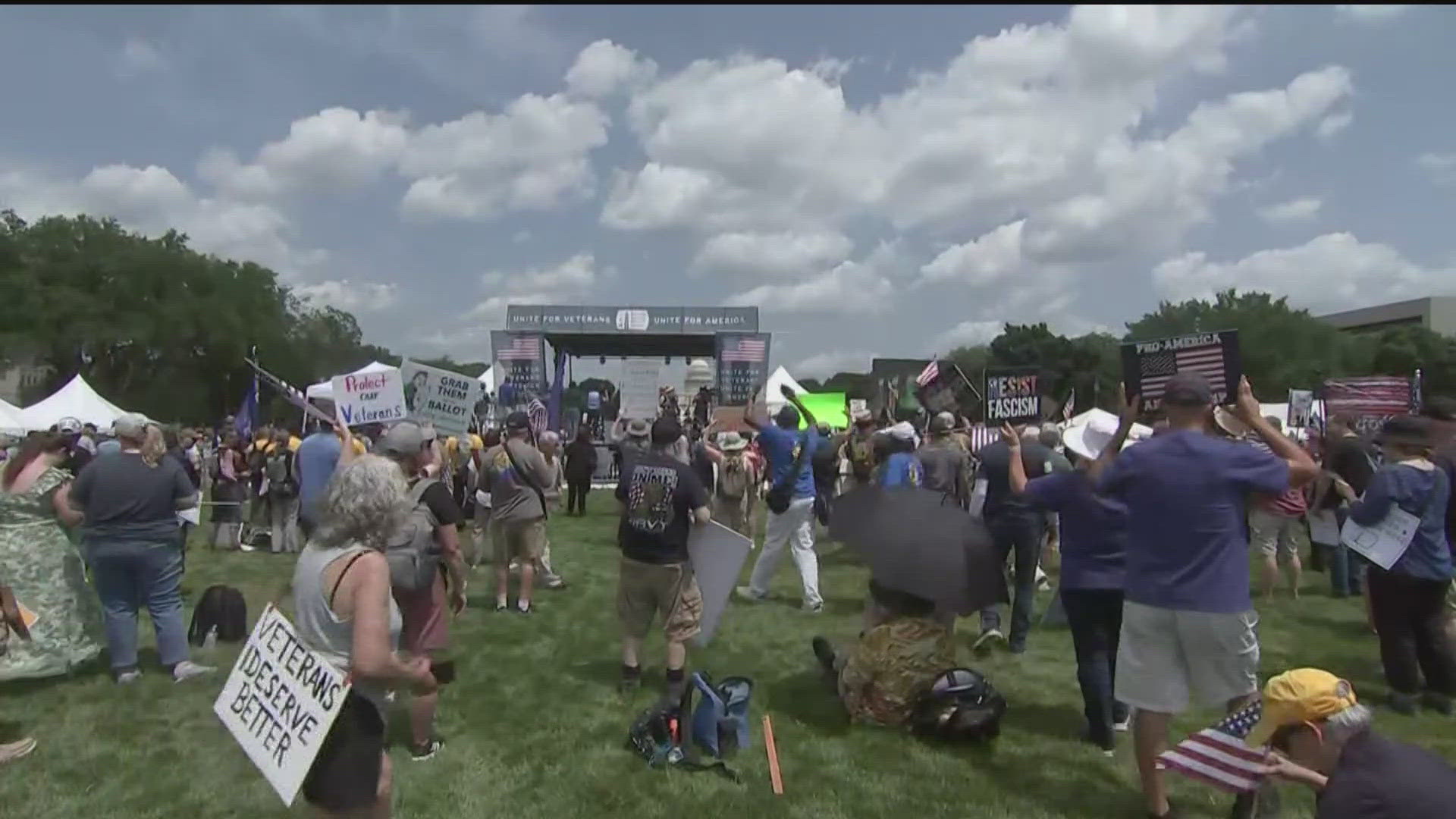Rallygoers demanded stronger protections for veterans and military families, including better job security.
