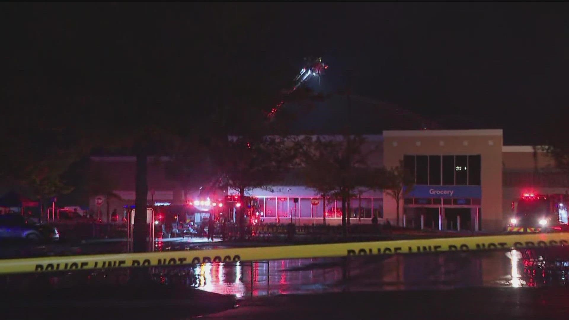 Crews are working to douse flames at the Walmart in Peachtree City Wednesday evening.