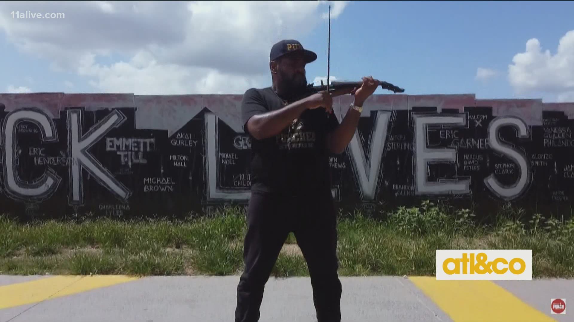 Violinist extraordinaire Richmond Punch performs in front of a 'Black Lives Matter' mural on the Atlanta BeltLine.