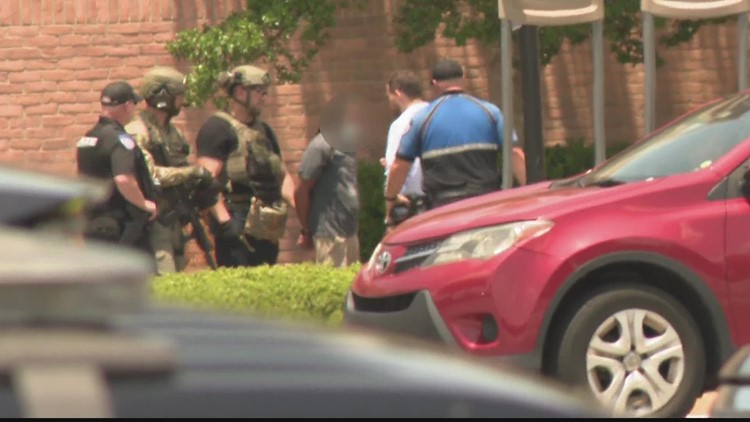 Disgruntled Home Goods employee with gun in custody after standoff