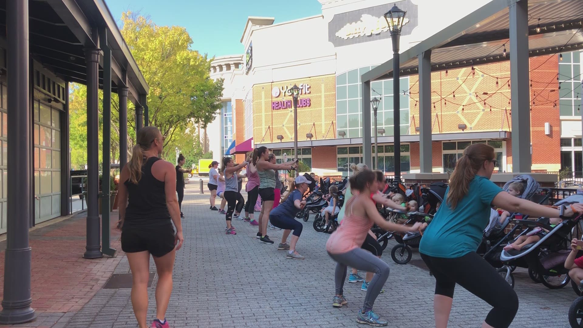 Video of Fit4moms trading in their weights for strollers.