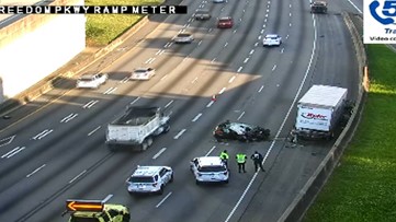 Woman killed after crashing into stopped truck on Downtown Connector