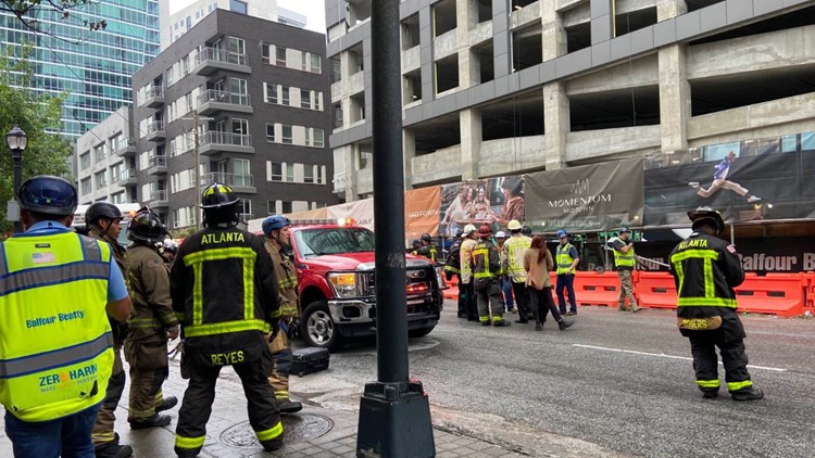 At least 4 hurt after crane collapses, damages building under construction in Midtown