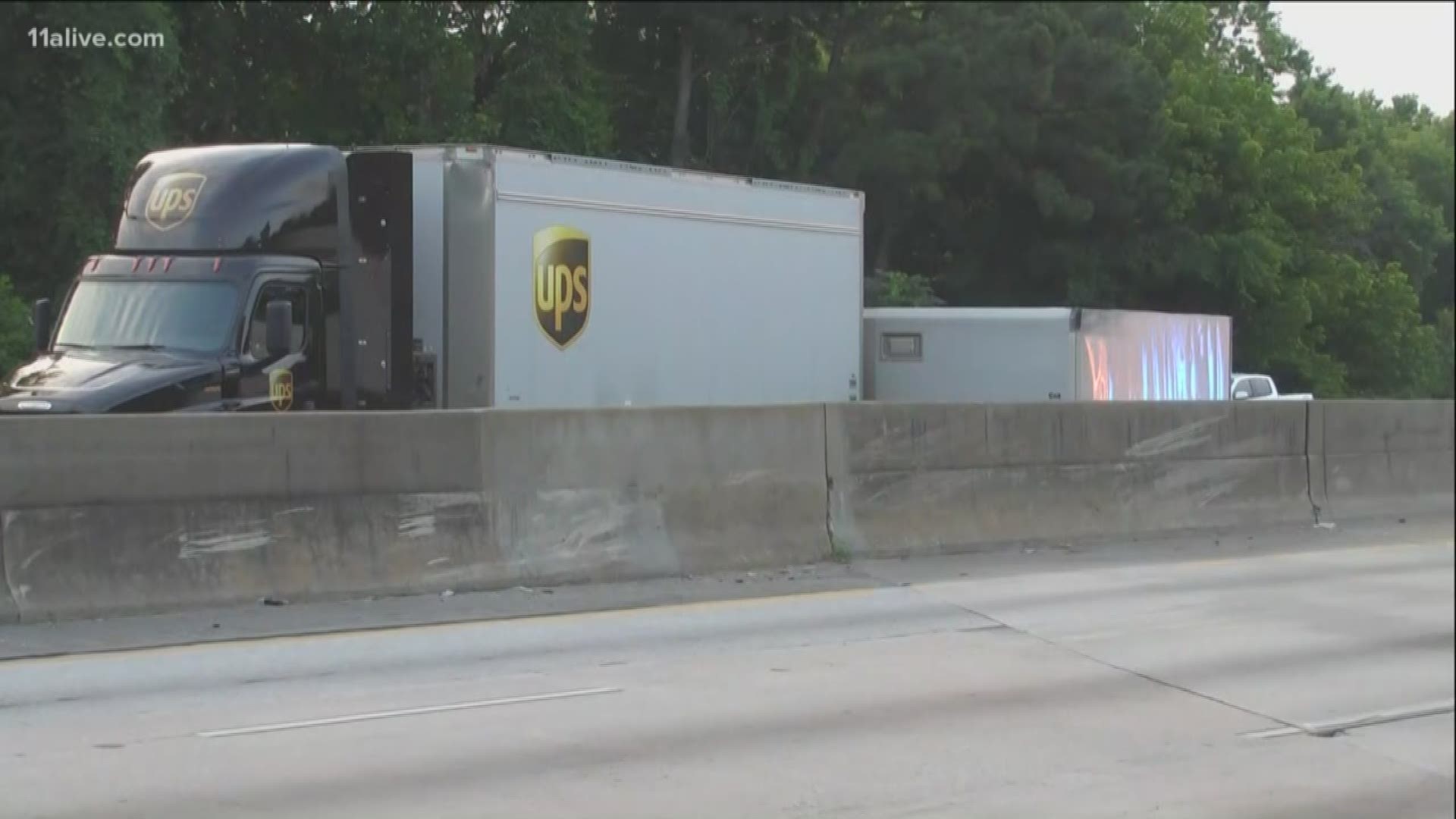 The back half of a UPS double tractor trailer overturned Tuesday morning, causing a major traffic backup on Interstate-285.