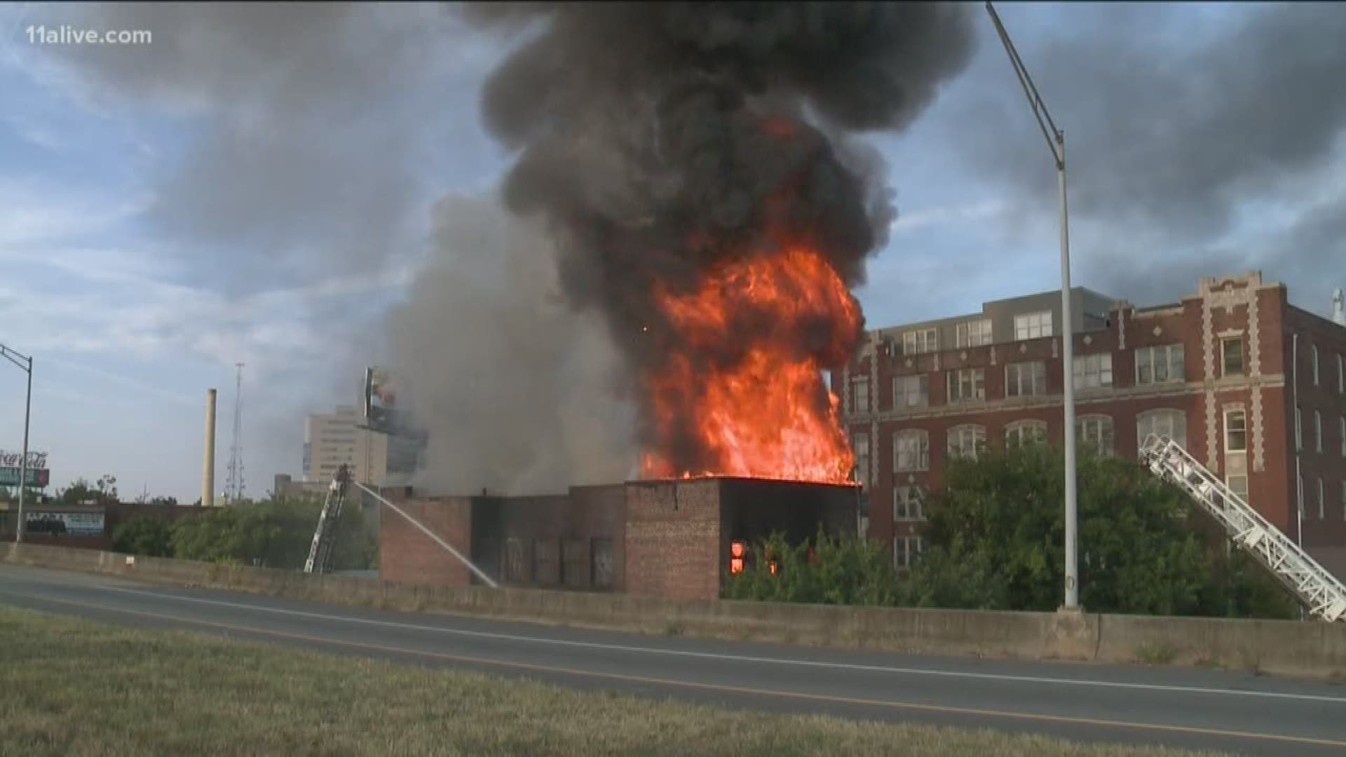 A two-story building on Auburn Avenue next to the Downtown Connector went up in flames on Sunday morning. No injuries were reported from Sunday's blaze.