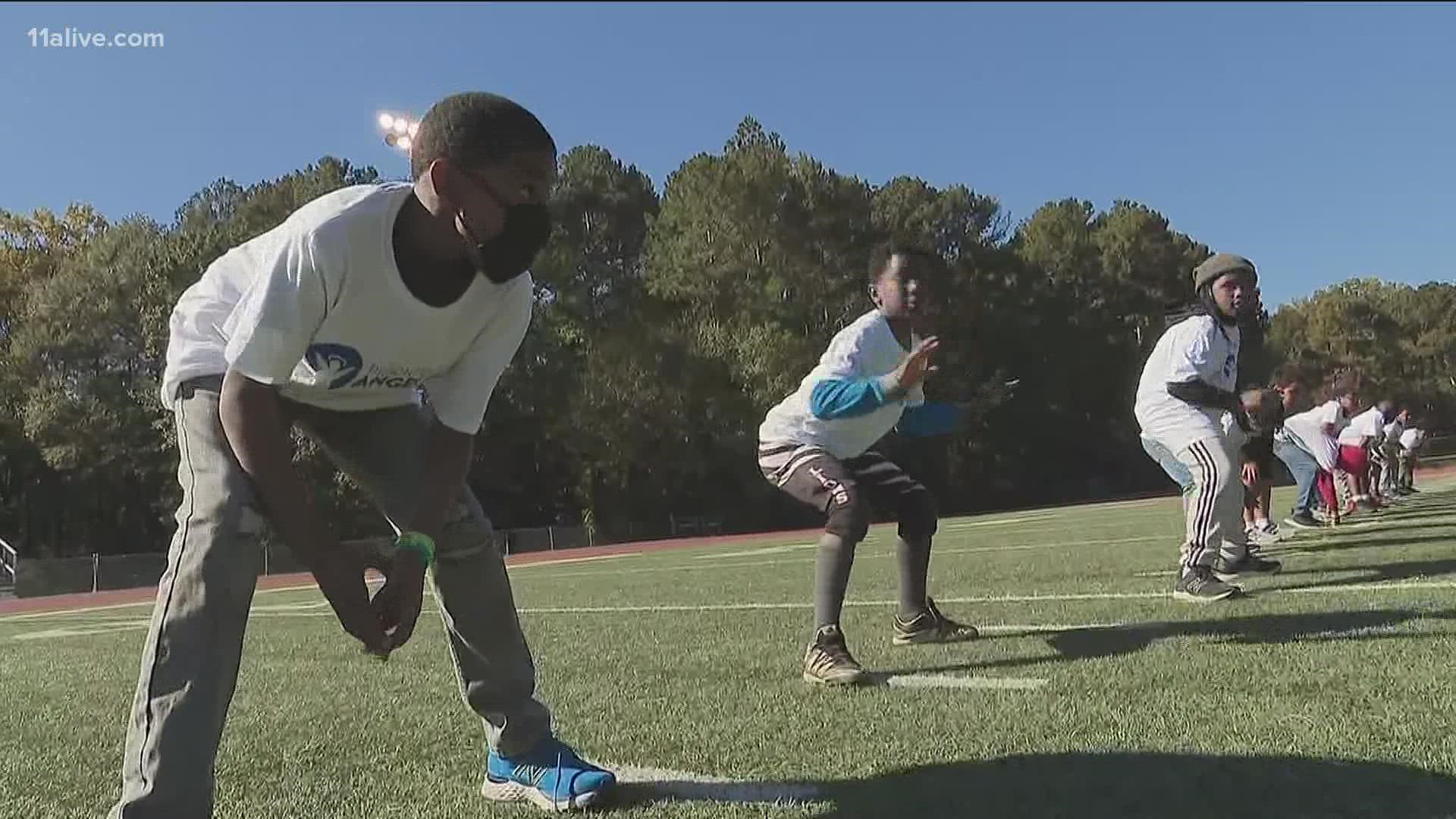 A prison fellowship is helping children by playing football.
