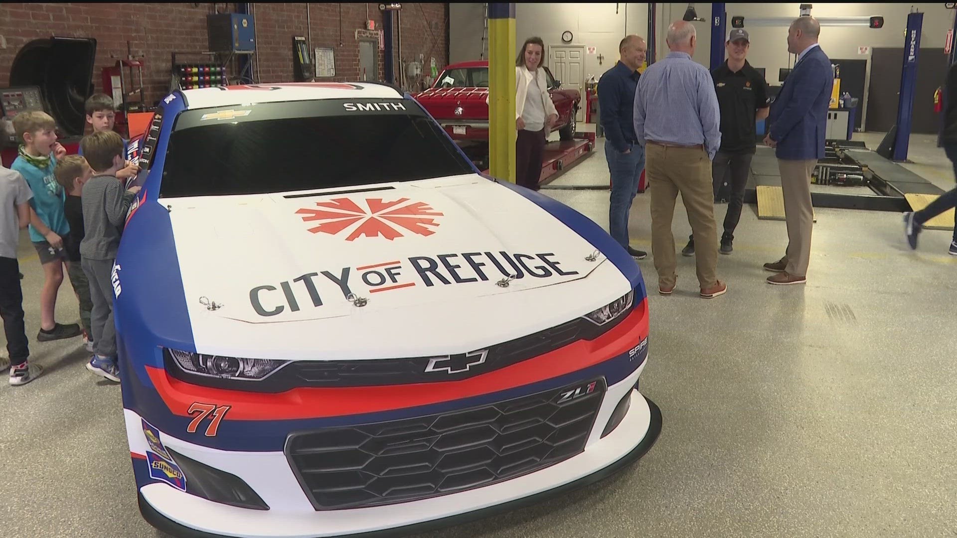 Smith is promoting City of Refuge on his car at the upcoming race.