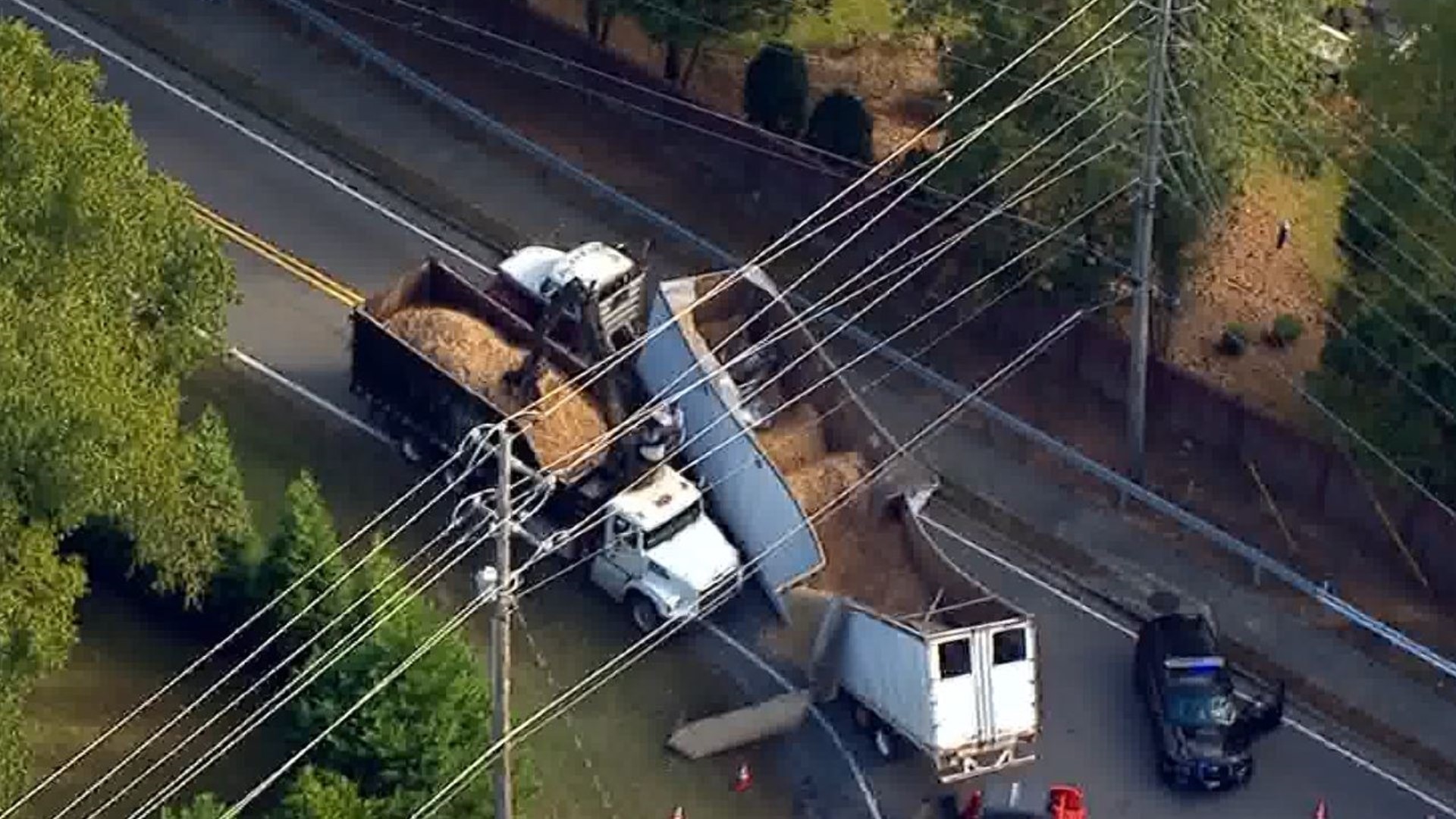 Tractor trailer splits in half shuts down all lanes of Milton road Aerials