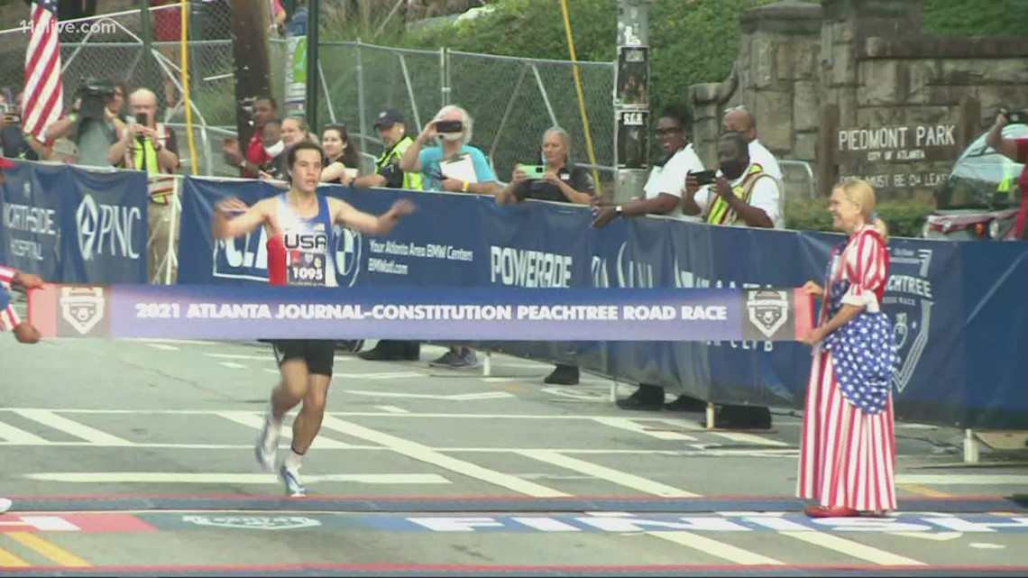 First runner comes across AJC Peachtree Road Race finish line